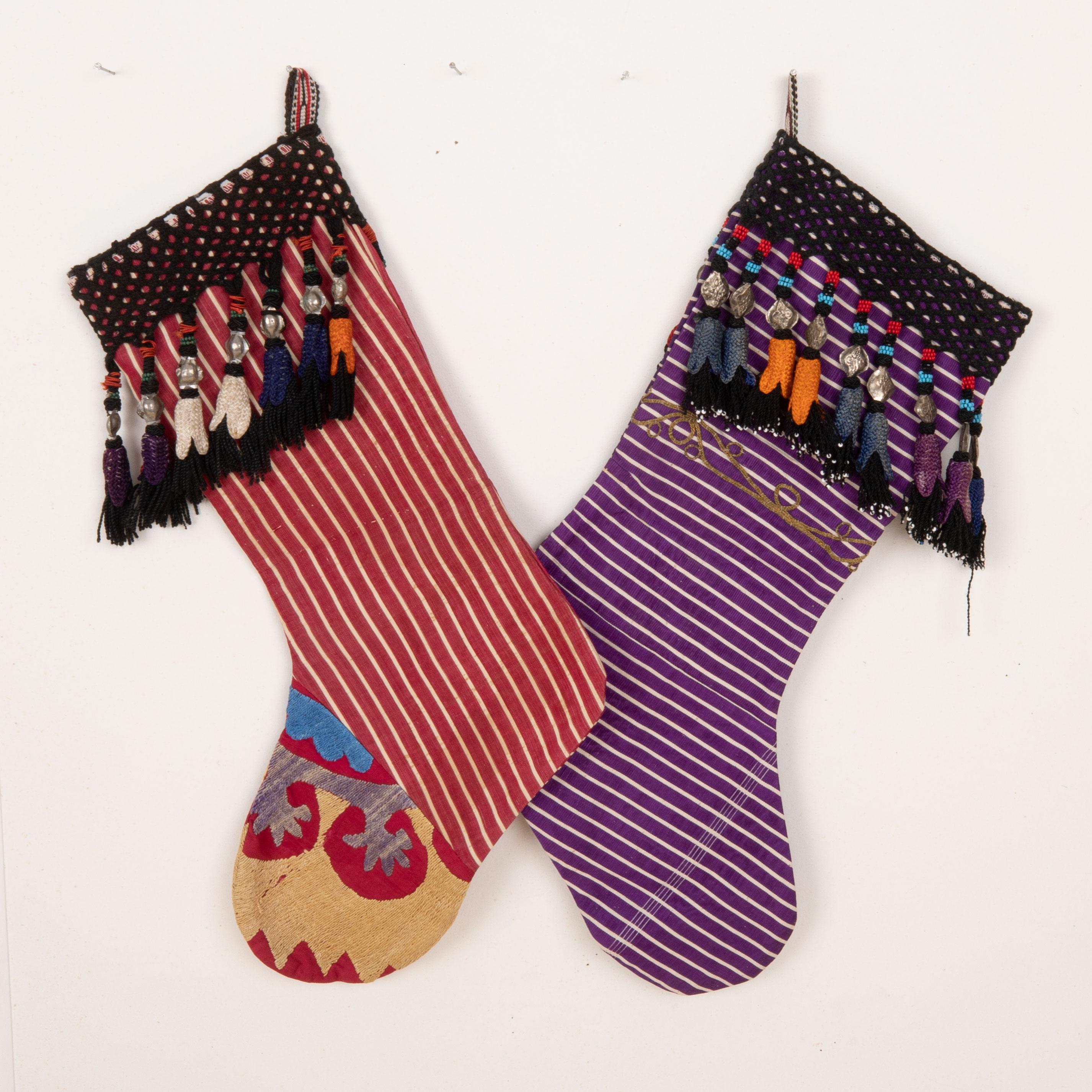 These Christmas Stockings were made from mid 20th C. Uzbek Velvet Fragments.

Please note these were made from vintage Turkish and Uzbek Textile fragments.
