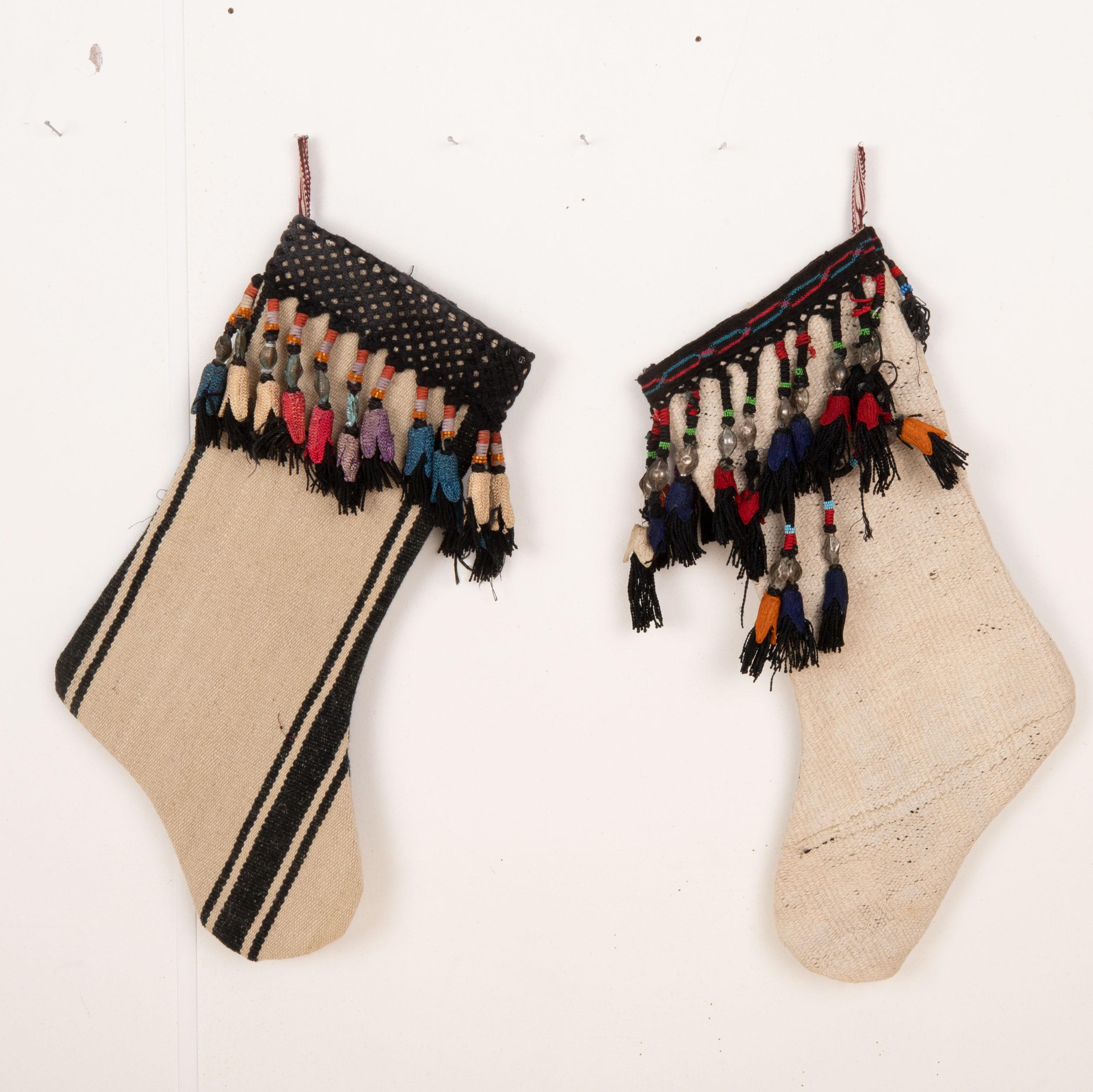 These Christmas Stockings were made from mid 20th C. Uzbek Velvet Fragments.

Please note these were made from vintage Turkish Kilim fragments.
