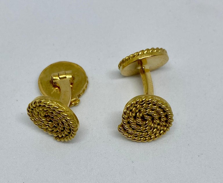 Extremely rare, handmade cufflinks in solid, 18K yellow gold featuring a coiled rope motif by MISH New York. 

Signed MISH and 18K, these cufflinks were a custom order. The four faces each measure 11.7mm in diameter. The backs are hinged, making the