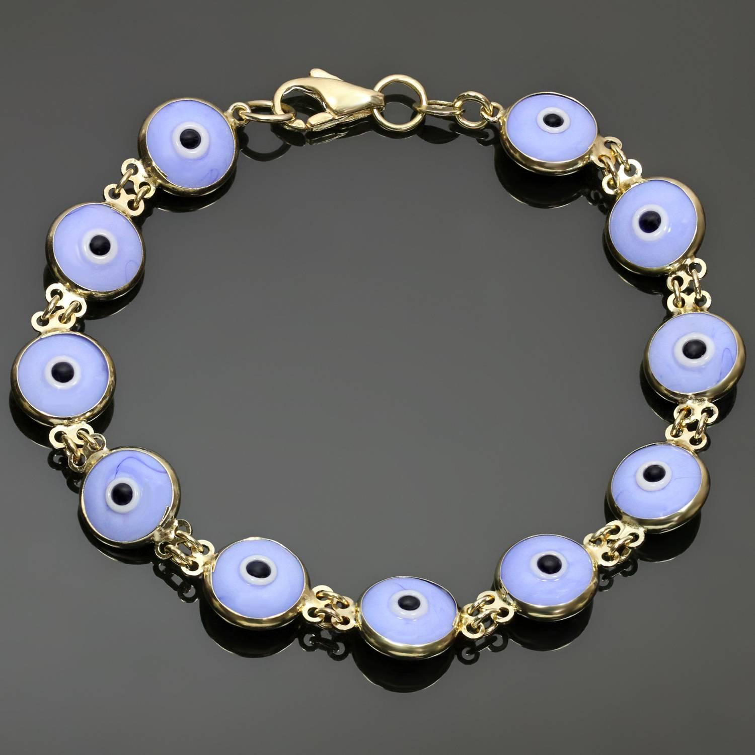 This classic good luck link bracelet features 11 round double-sided evil eyes crafted in enamel and 14k yellow gold. Made in United States. Measurements: 0.38