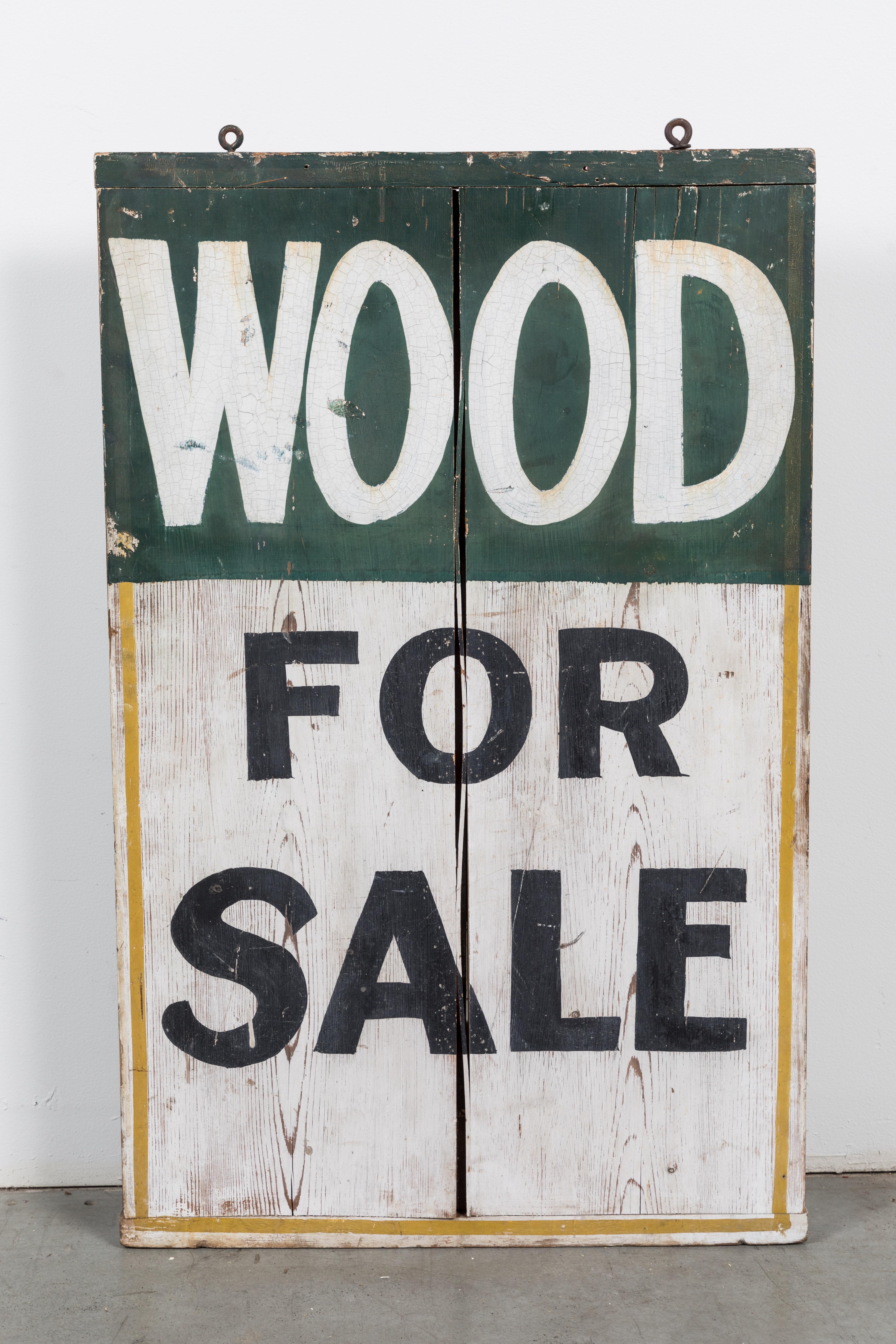 Double sided general store trade sign, circa 1900. Each side perfectly graphic. Appears to have been done by the hand of a professional sign painter. One side ice for sale and the other side wood for sale.