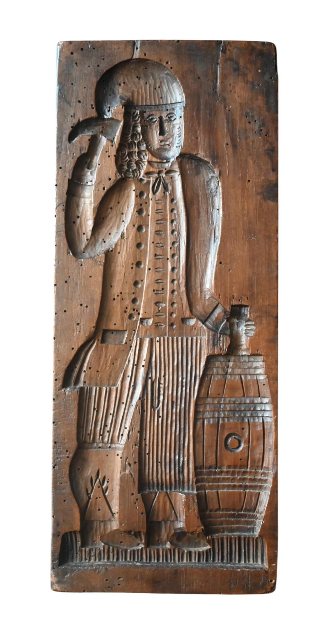 Double-Sided Carved Gingerbread Mould, 19th Century
Wood, 17.2 x 41.8 cm

A large hand-carved wooden gingerbread mould (speculaasplank), carved on both sides with richly detailed figures. One side depicts a gentleman in 17th/18th century attire,