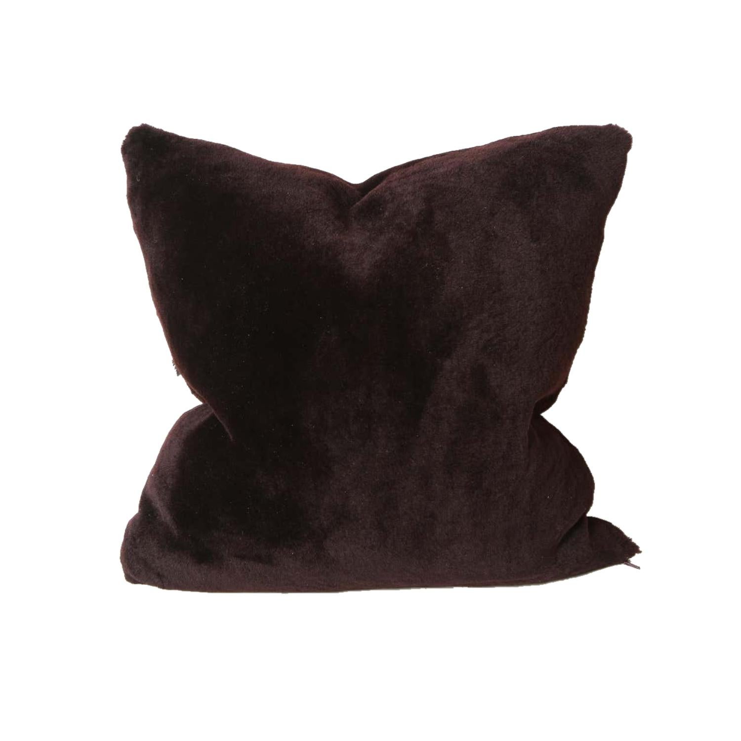 Double sided Merino short hair shearling pillow in deep plum color. The pillow is made of genuine shearing with a zipper enclosure in a matching color.