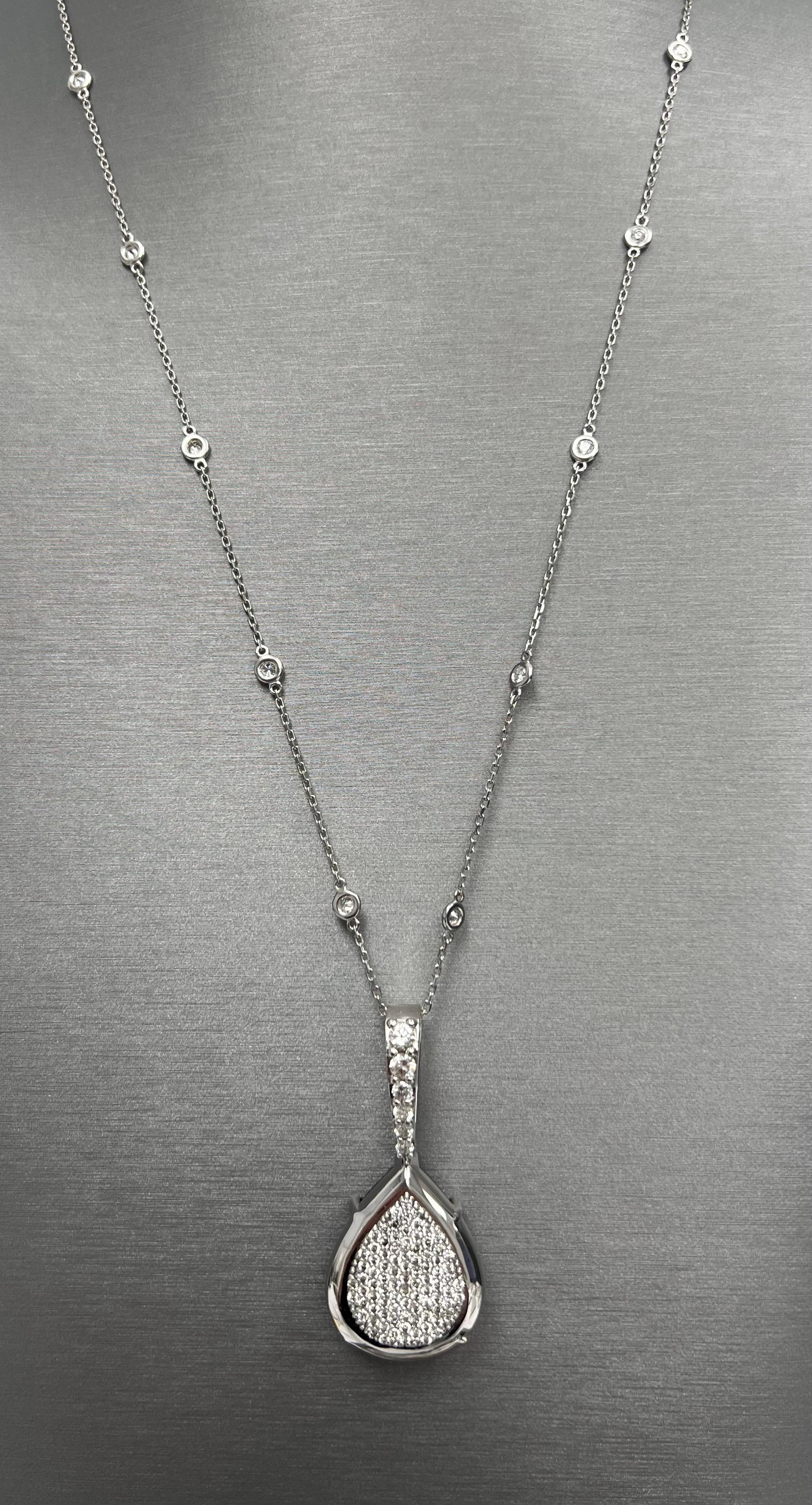Double sided Natural 35.81ct Black Pear Diamond Pendant in 18k White Gold with Diamond Chain.
ONE SIDE HAS A 35.81CT PEAR SHAPE NATURAL BLACK DIAMOND, OTHER SIDE HAS A PAVET OF NATURAL DIAMONDS.
This exquisite pendant showcases a remarkable