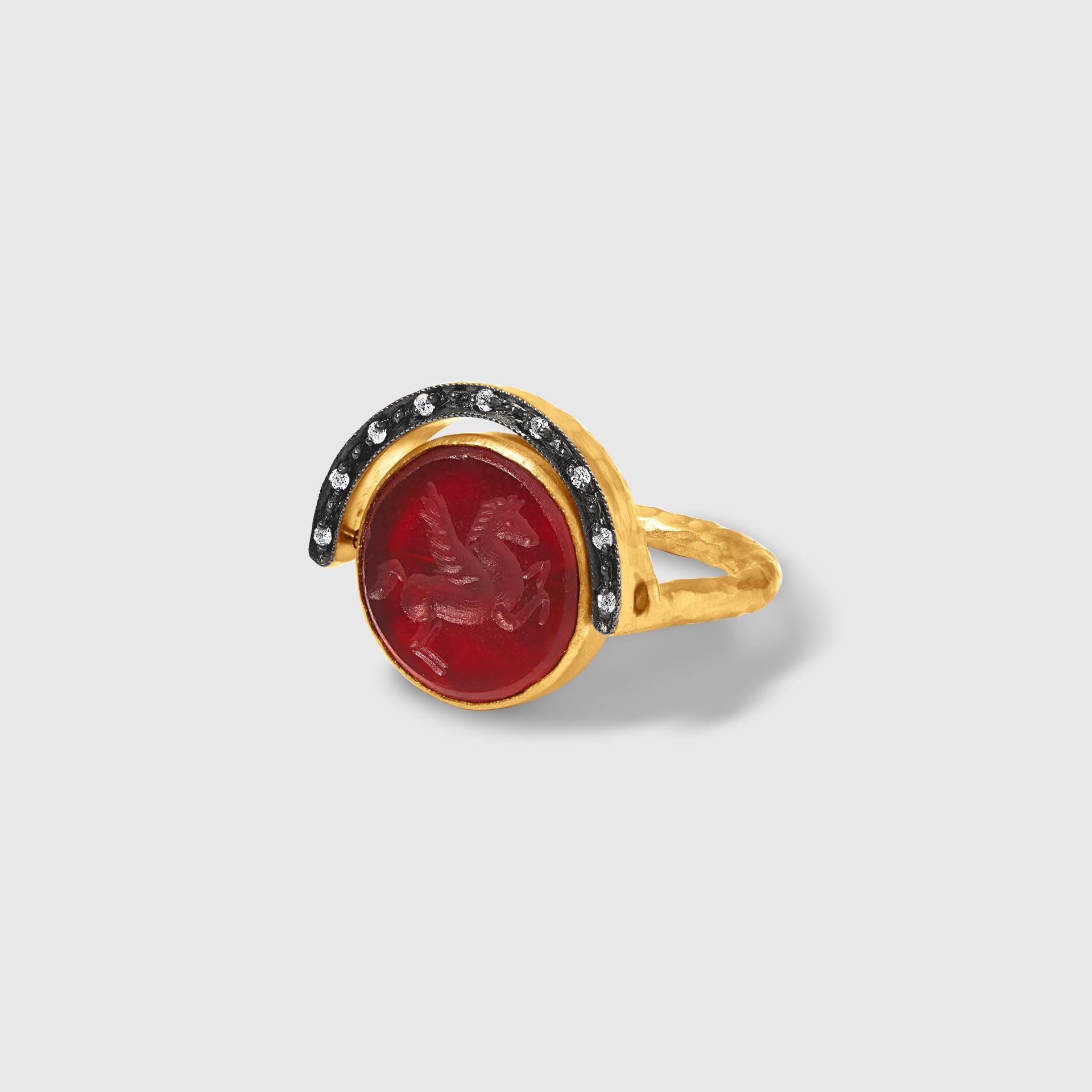 Double sided Ring with Carved Agate Pegasus and Byzantine Coin Fragment Kurtulan
24kt gold-fused on sterling silver, white diamond detail. Size 7. Coin is hinged and can be moved back and forth - from day to night.
About Kurtulan:
Kurtulan jewellery