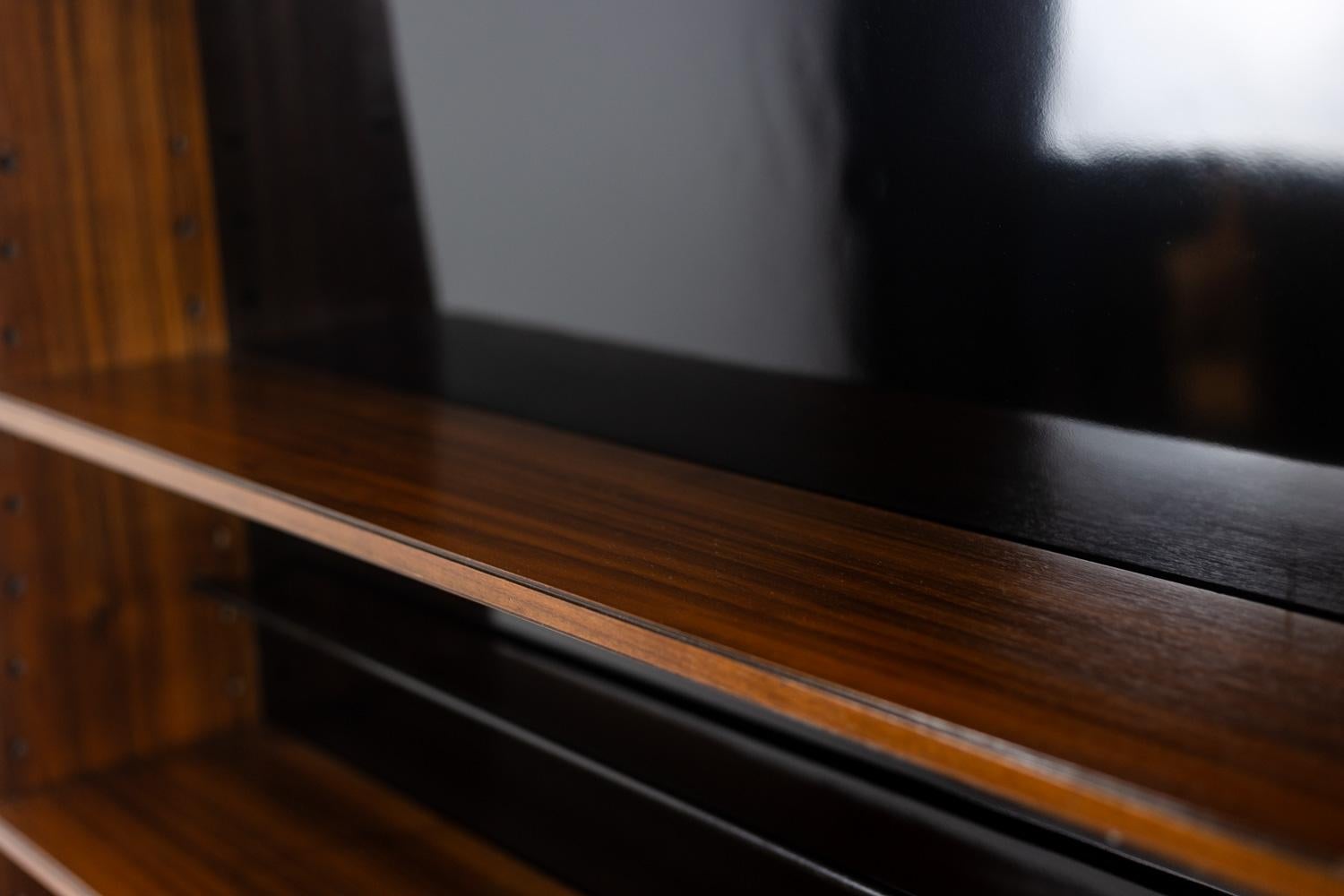 Rosewood “Double-sided” rosewood bookcase on casters. Circa 1960. LS58761008H For Sale