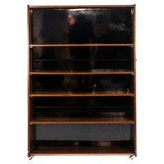 “Double-sided” rosewood bookcase on casters. Circa 1960. LS58761008H