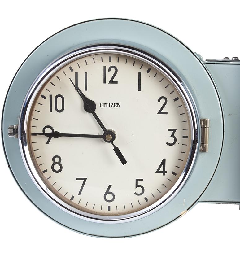 From a decommissioned ship, a passageway or hallway clock that is double sided so that you see the time from either direction. Metal casing with its original green paint with chrome accents. Reworked to run on quartz AA battery instead of hard-wired