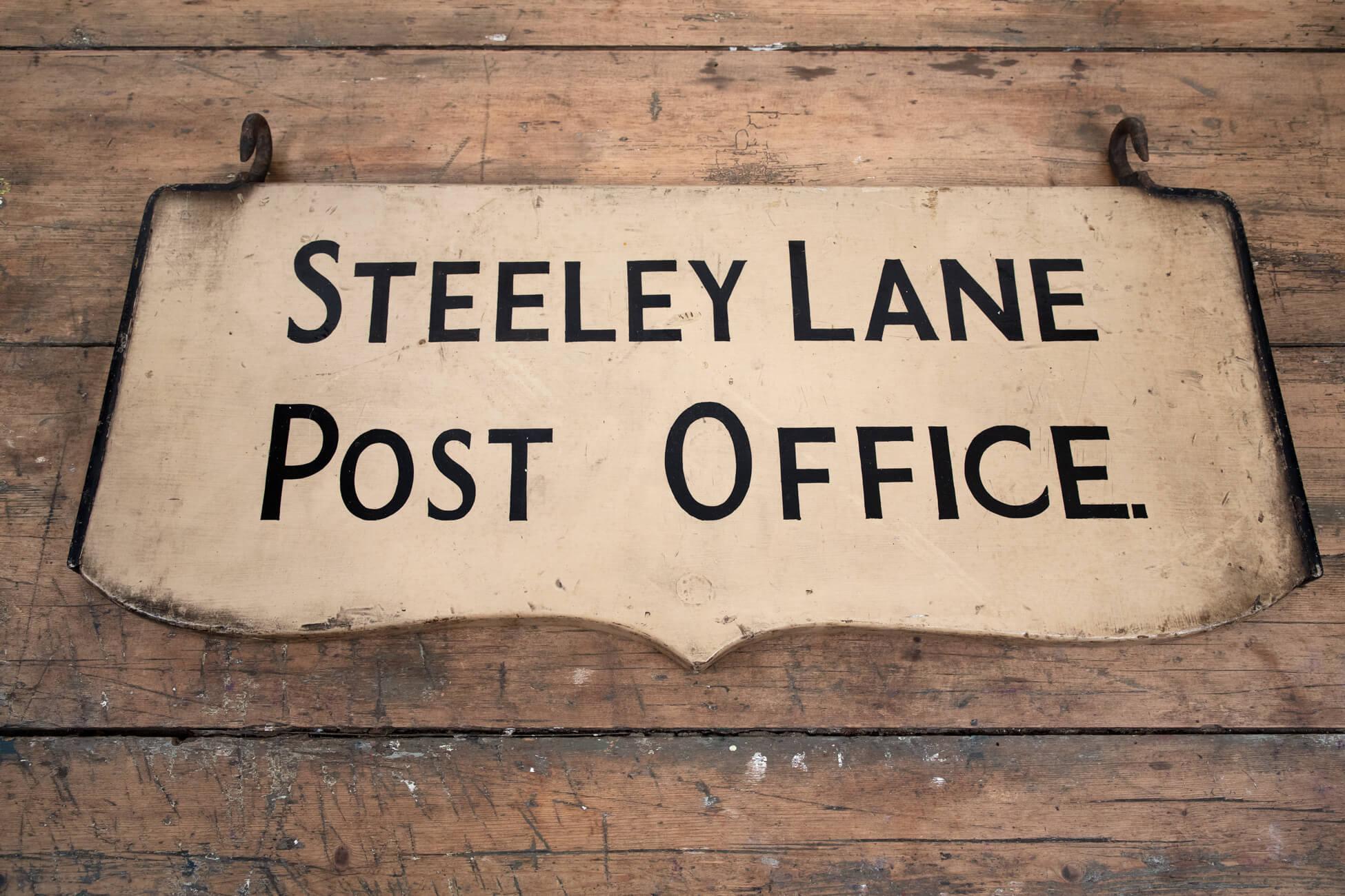 Wonderful double-sided Steeley Lane Post Office Sign. Hand-painted and in completely original condition with its original hanging hooks. 
Cumbrian, circa 1920s.

Additional information:
H30 cm (H 11.8 inches)
L: 64 cm (L 25.1 inches)
D 2.5 cm