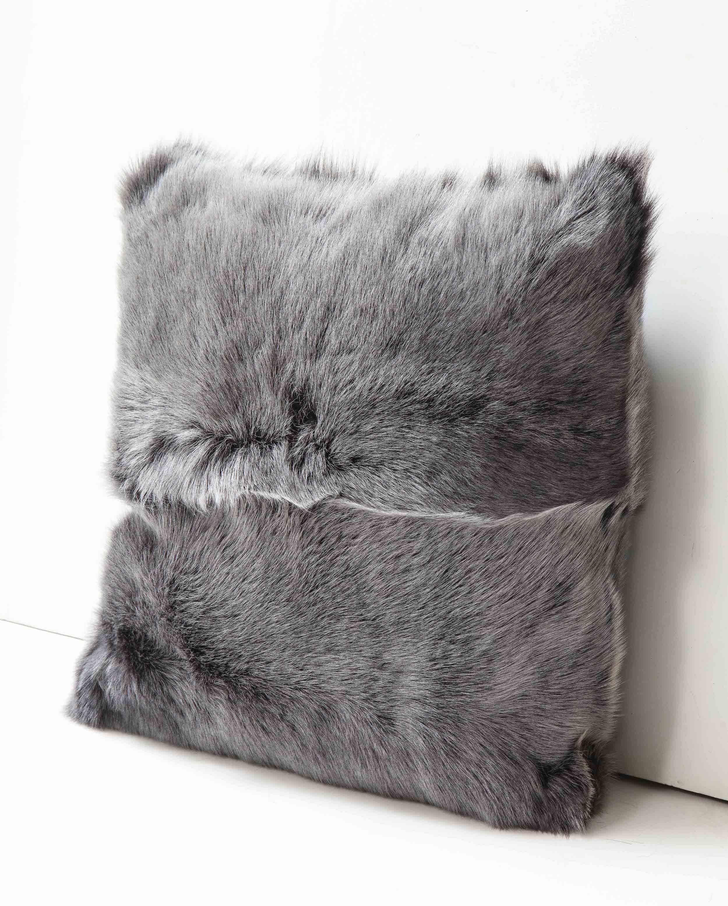 Beautiful custom double sided long hair Toscana shearling pillow in grey color. Very elegant in look and tangibly luxurious. It is made of genuine shearing with a zipper enclosure in a matching color, filled with down and feather, and 18