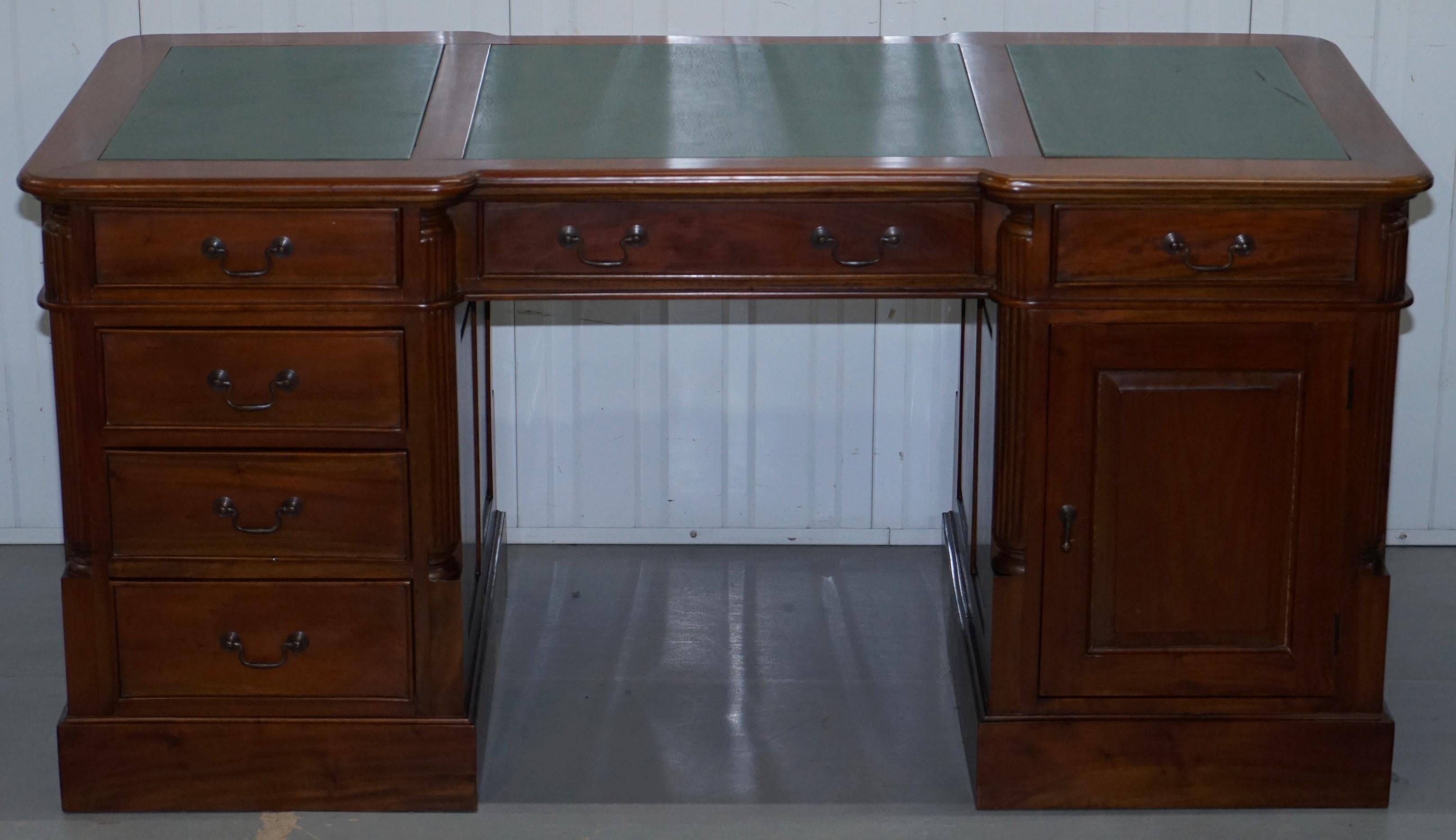 We are delighted to offer for sale this large twin pedestal partner desk finished in solid mahogany and with a green leather top, drawers and cupboards to both sides

A very good looking and well-made desk with a lovely timber patina, it's hardly