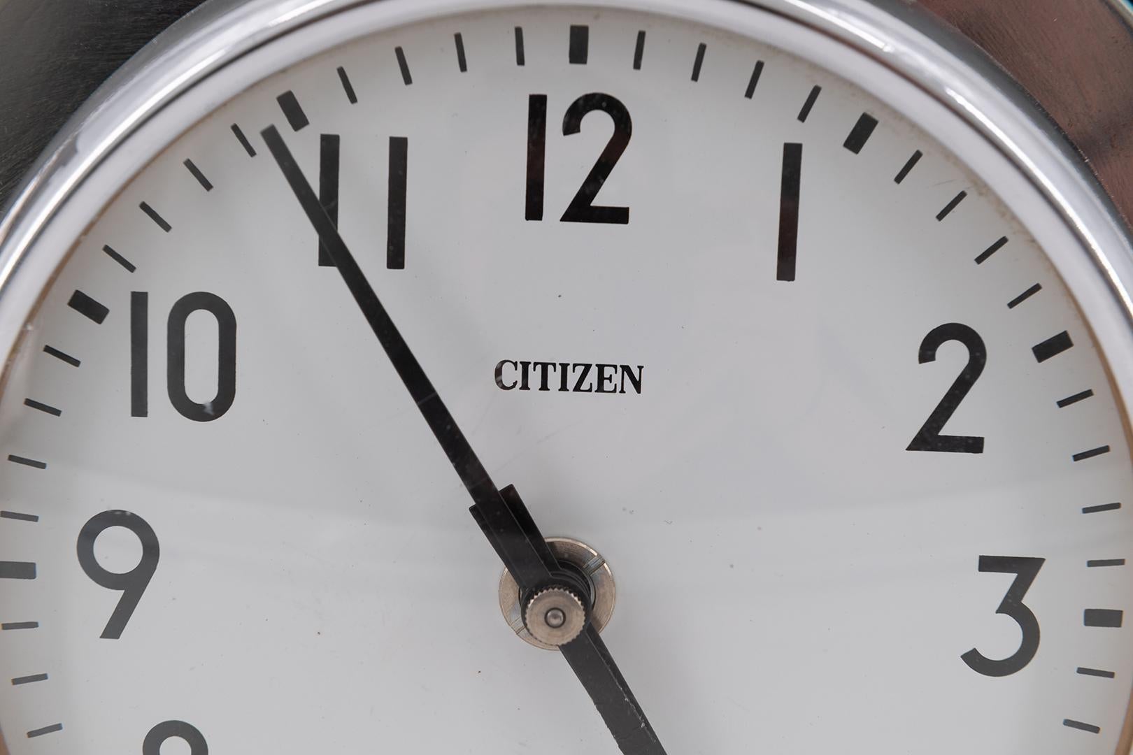 Citizen sleek design double sided clock in steel and chrome. A real statement piece bringing a smile on everyone's face! In a rare good condition, this clock used to be a slave clock on a ship and currently retains the electric movement which can be