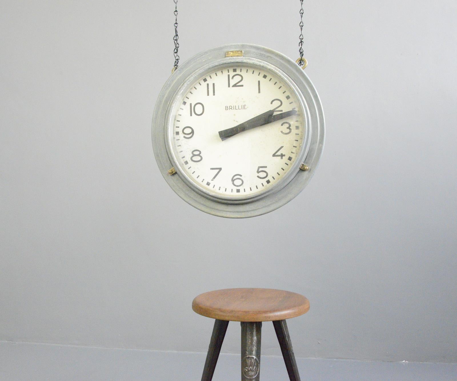 Double sided zinc station clock by Brillie, Circa 1920s

- Zinc casing
- Tin dials
- Glass faces
- New AA battery powered quartz motors
- Comes with chain 
- Made by Brillie
- French ~ 1920s
- 54cm wide x 54cm tall x 20cm deep

Condition