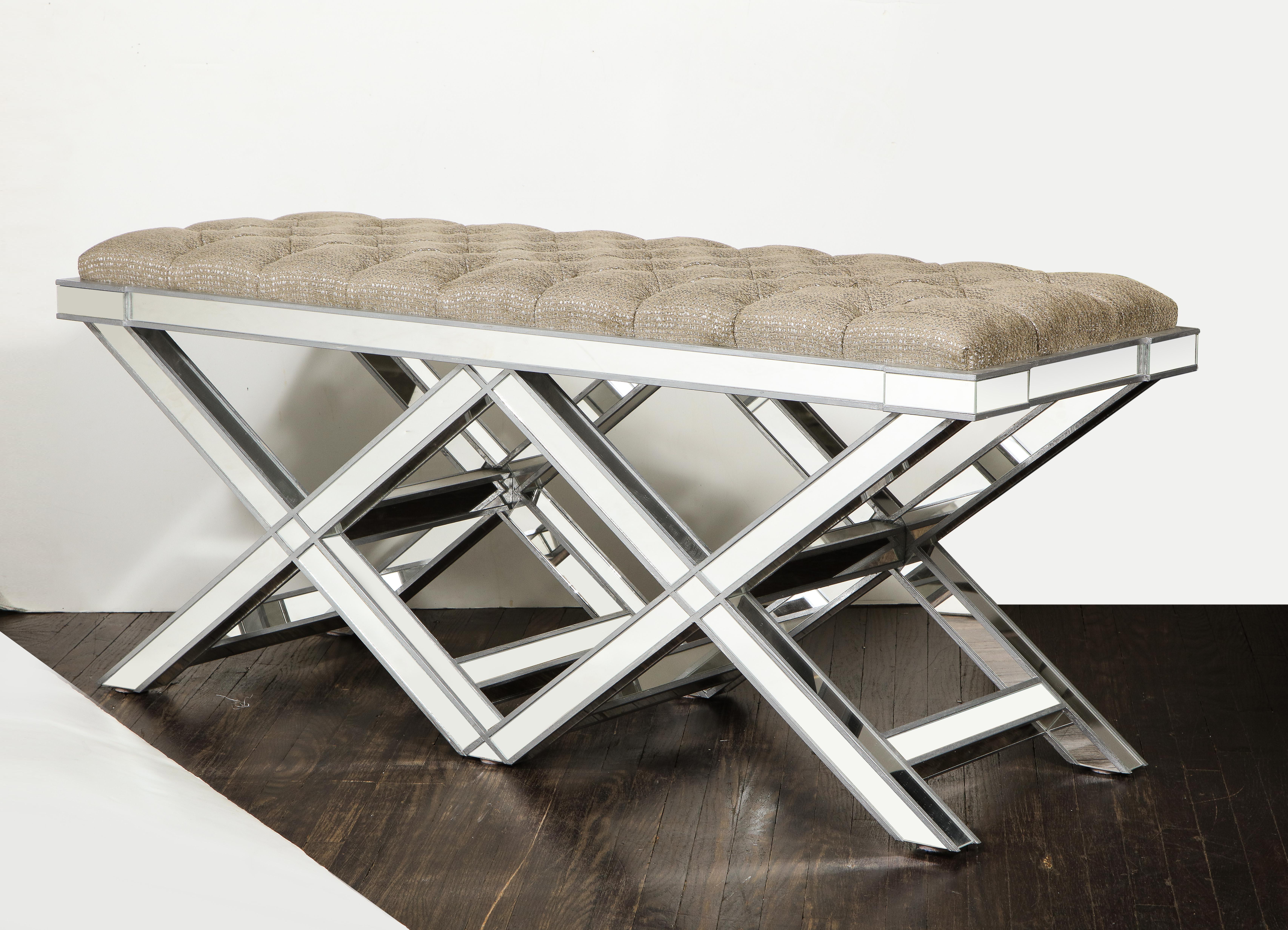 Custom double silver trim mirrored X-band bench with upholstered tufted fabric cushion. Customization is available in different sizes, finishes, and fabrics.