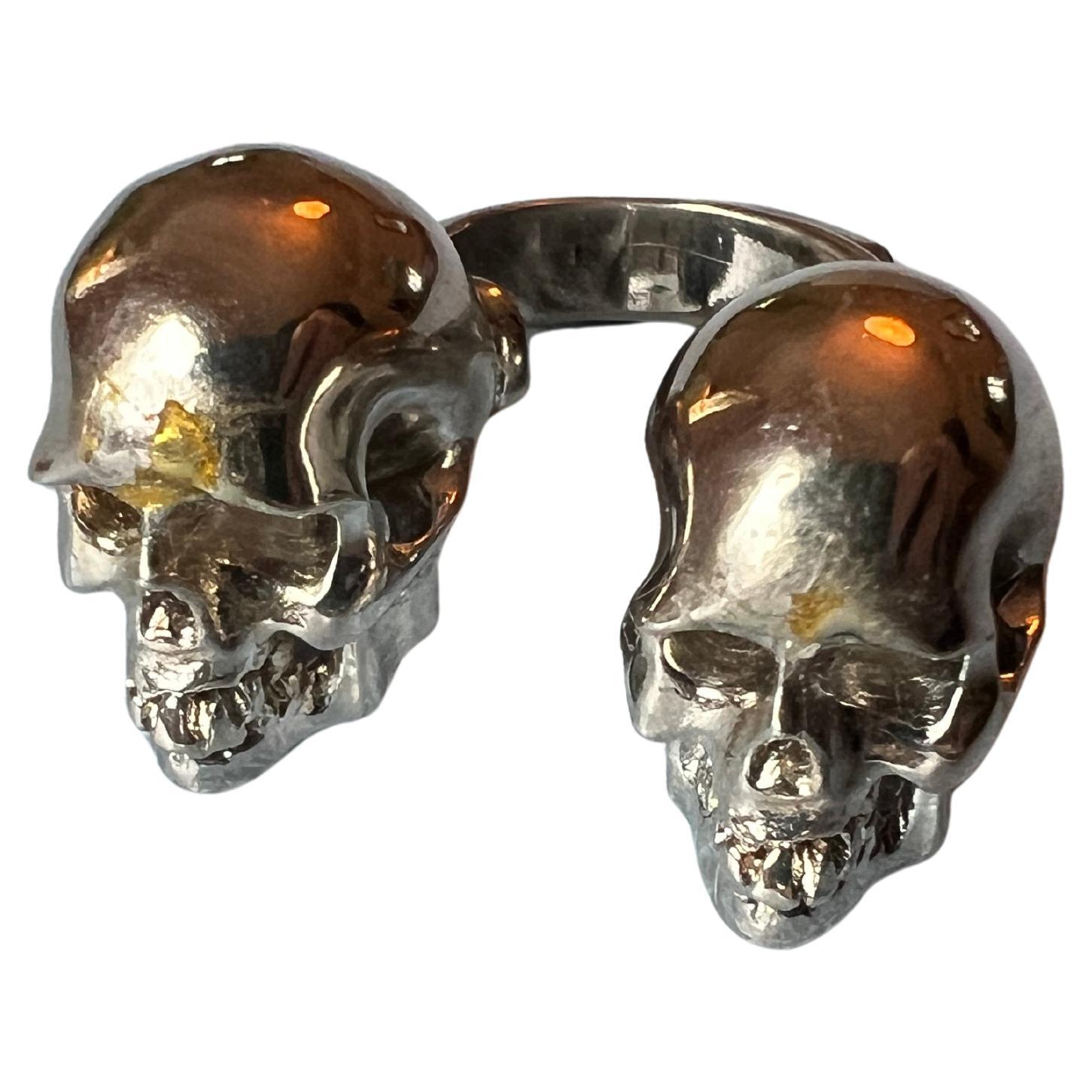 Double Skull Ring Platinum Plated Brass

This is a Vintage piece made in 2010 in NYC, US
It has not been used but was made to have a vtg look, which you can see on front.

Designer: J Dauphin

Made to order in silver or Gold

Available for immediate