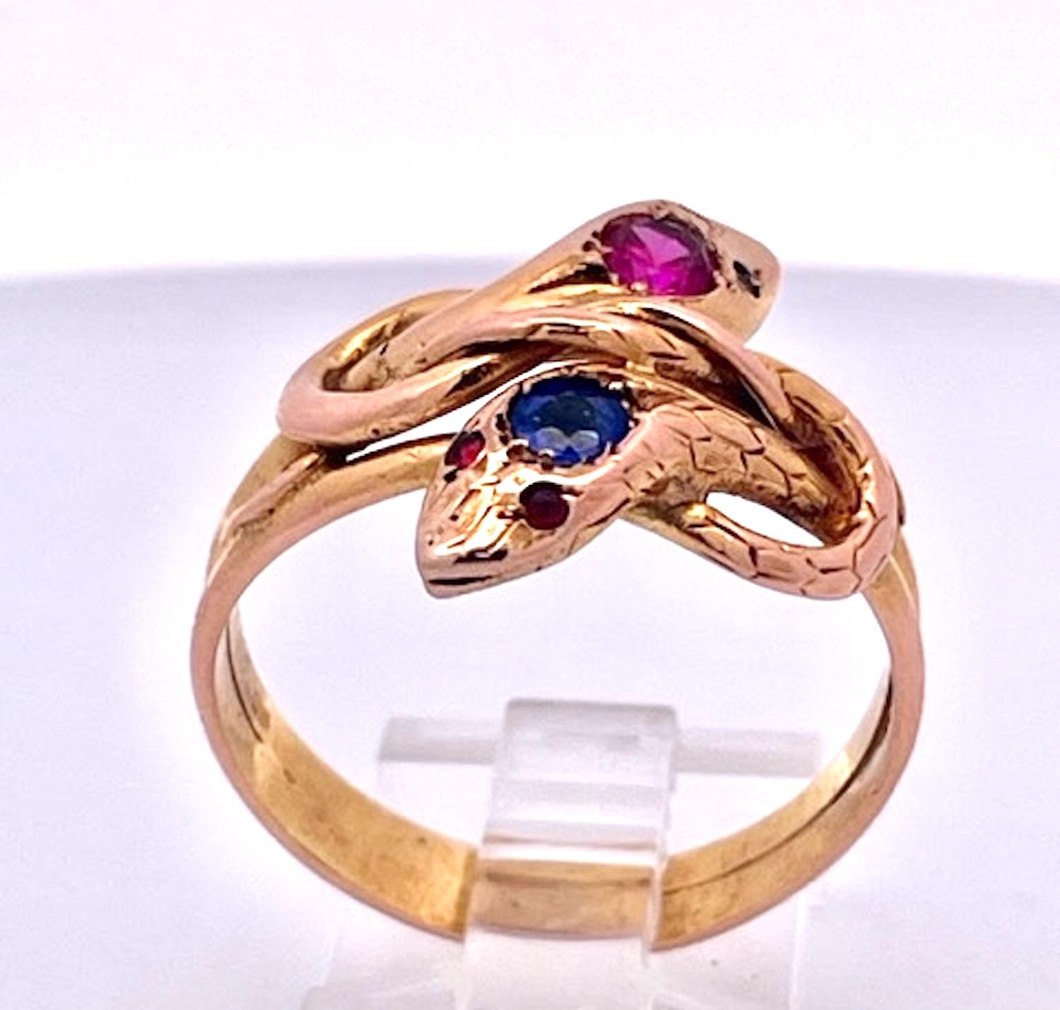 This lovely snake ring goes so well with the listed bracelet in another of my listing.  This double snake ring has 1 Pink Sapphire and the other has 1 Blue Sapphire on the head.  I believe these to be synthetic stones because they were not tested