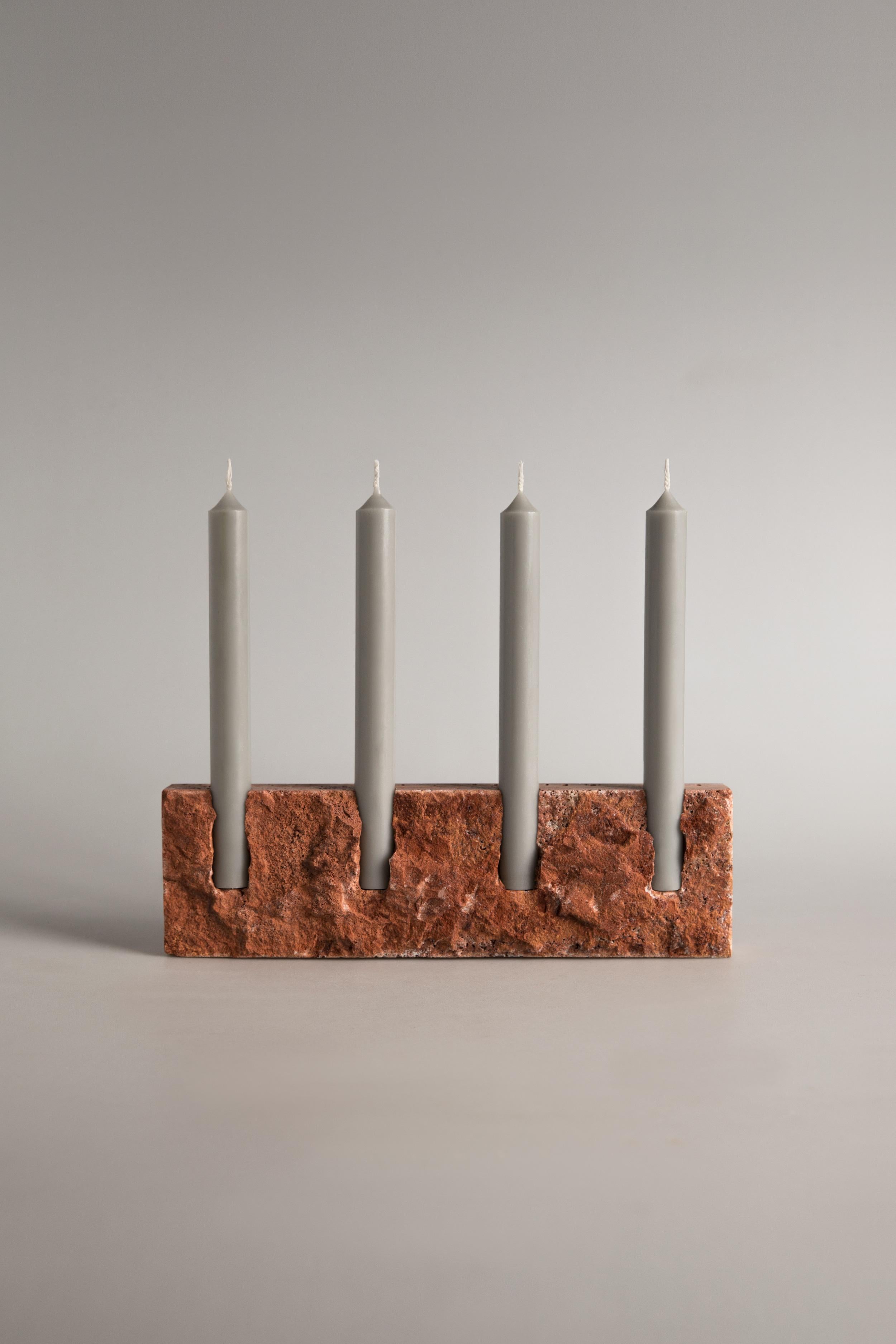 Handcrafted candle holder in Persian travertine with rock face front (hand chipped) and smooth sides. Please note that each stone is unique and reacts differently, therefore important variations in colour, shape and texture occur.

Snug candle
