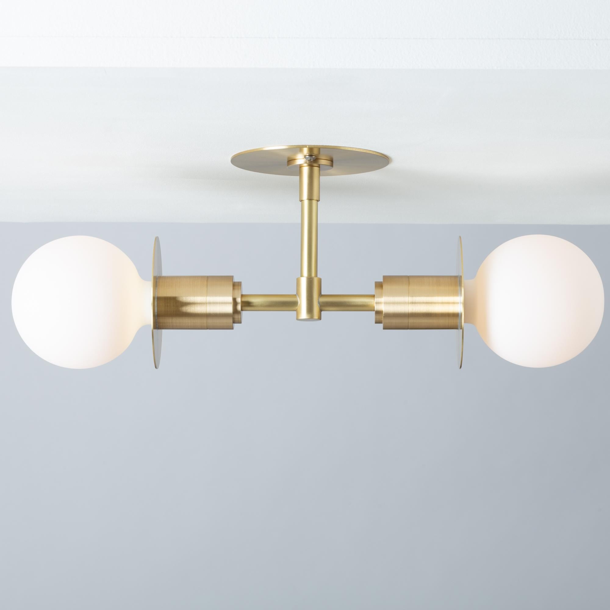 Double Sphere Disc Ceiling Light 
Brushed brass flush ceiling plate
2000K - 2800K  95CRI
1200 Dim to Warm Lumens 
Flush mount Hard Wired
Sphere III Bulbs Included
Handmade by Lights of London in Hackney Wick, London.