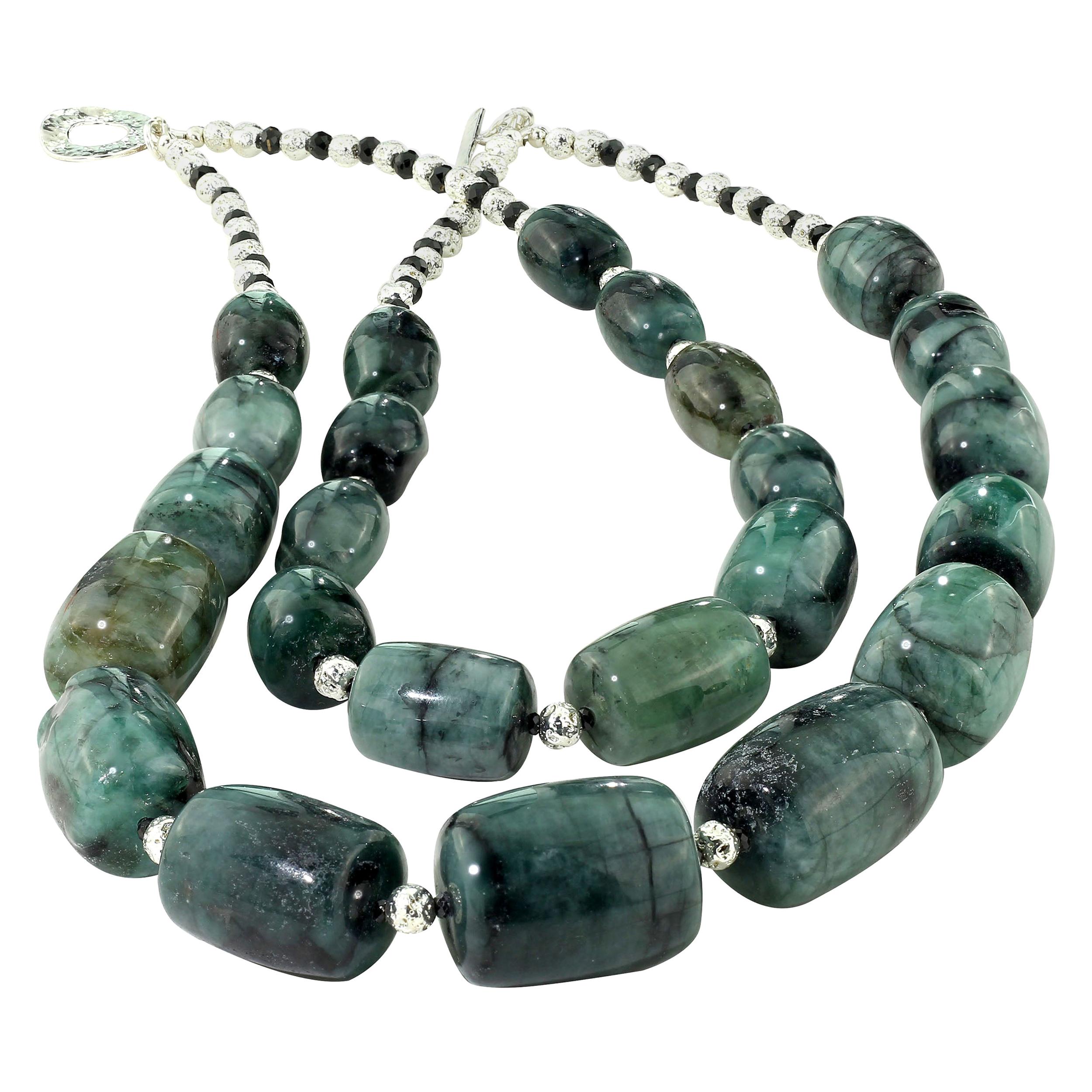 Emerald in matrix double strand necklace with silver and black spinel accents. Stunning graduated barrel shaped Emerald matrix which has a marbled look and a shade of green which will complement whatever you wish to pair it with. This unique