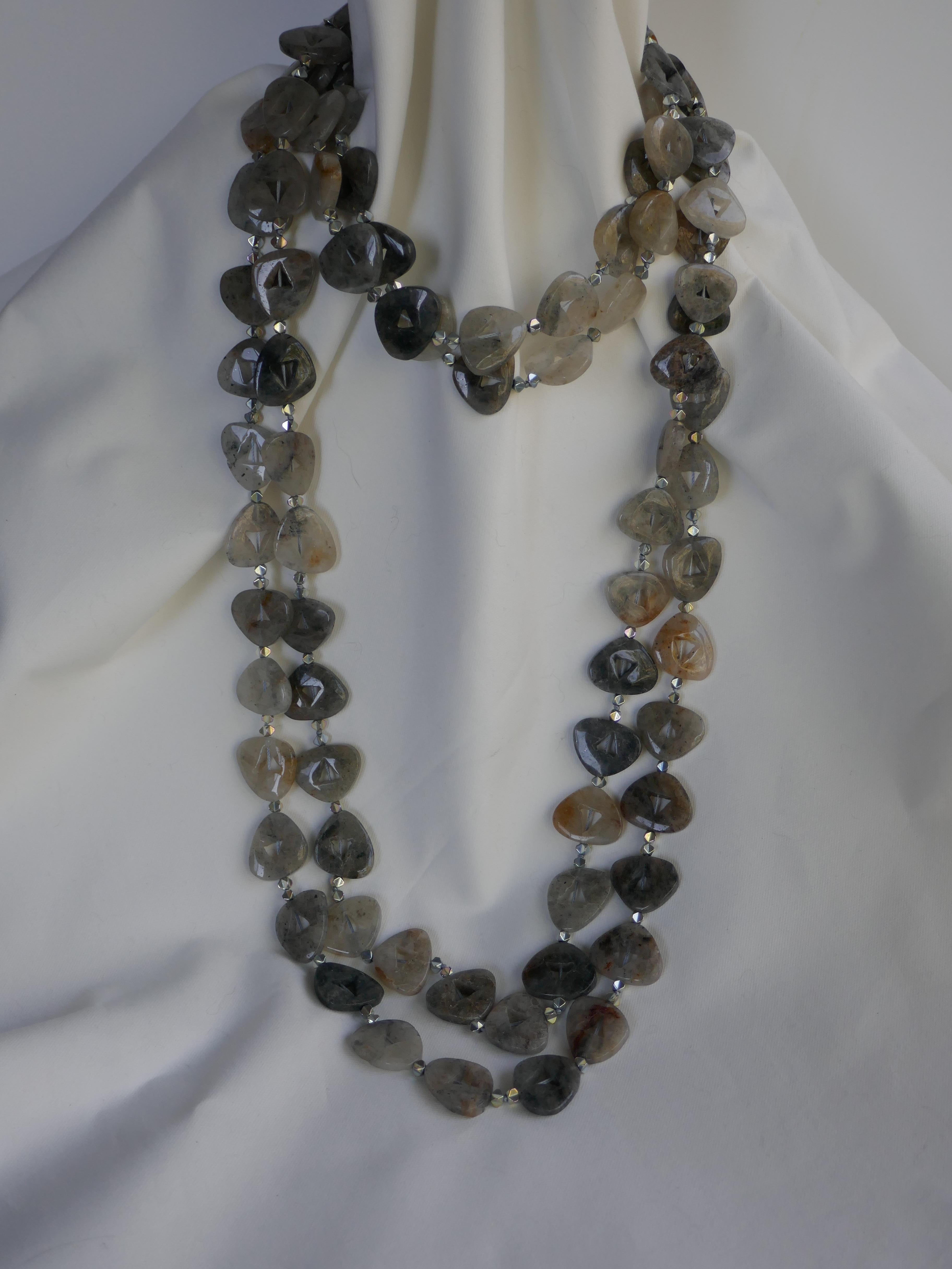 The black rutilated quartz beads on this necklace is amazingly beautiful. I have mixed black rutilated quartz with silver plated hematite making the black rutilated quartz pop out against the silver hematite beads.  The necklace can be worn various