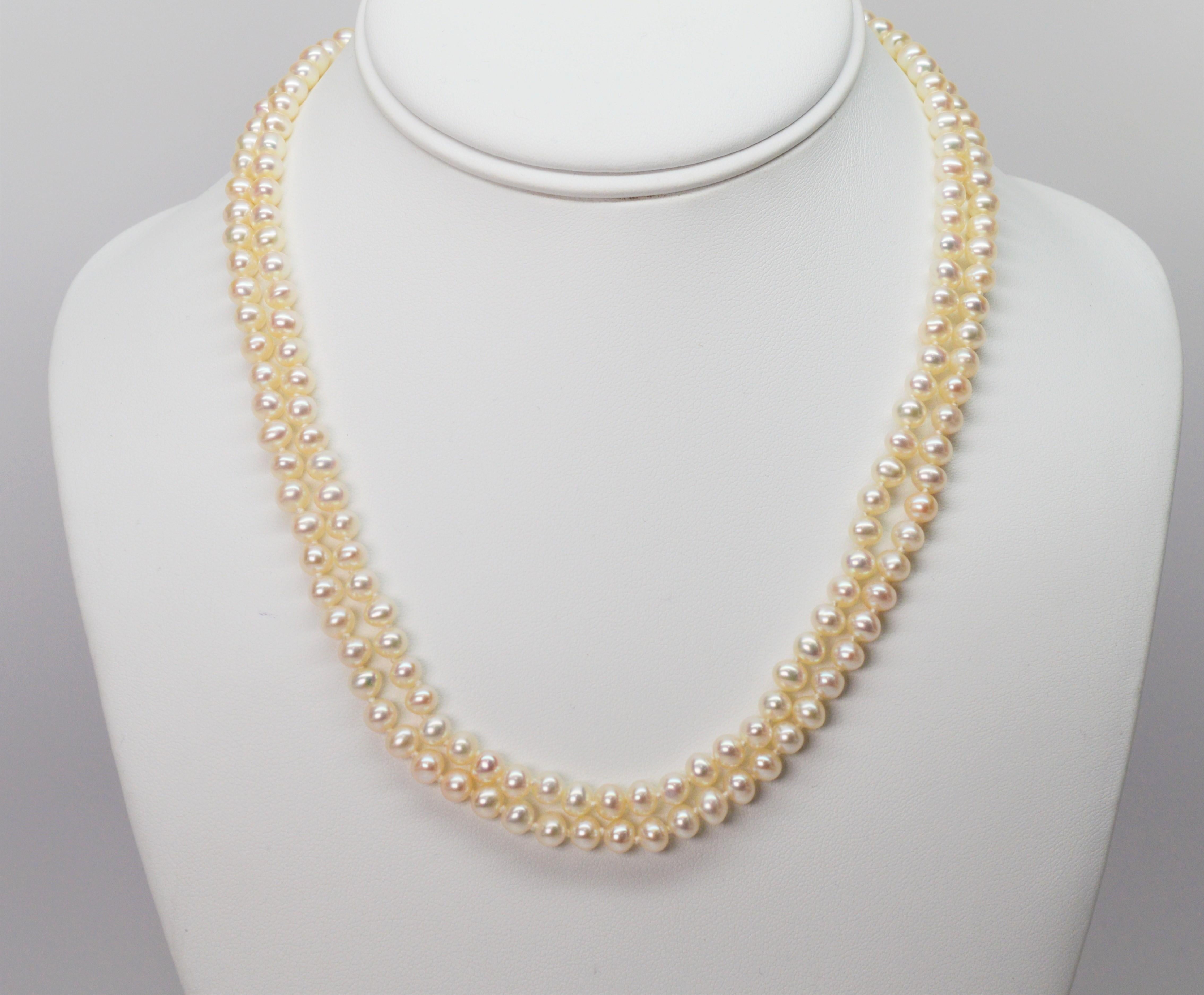 Find simple elegance in this classic duo. Two hundred thirty two fine off-round 5.5 mm AA button Akoya pearls are hand strung and knotted to create this double necklace and bracelet. Each piece is finished with a decorative filigree box clasp made
