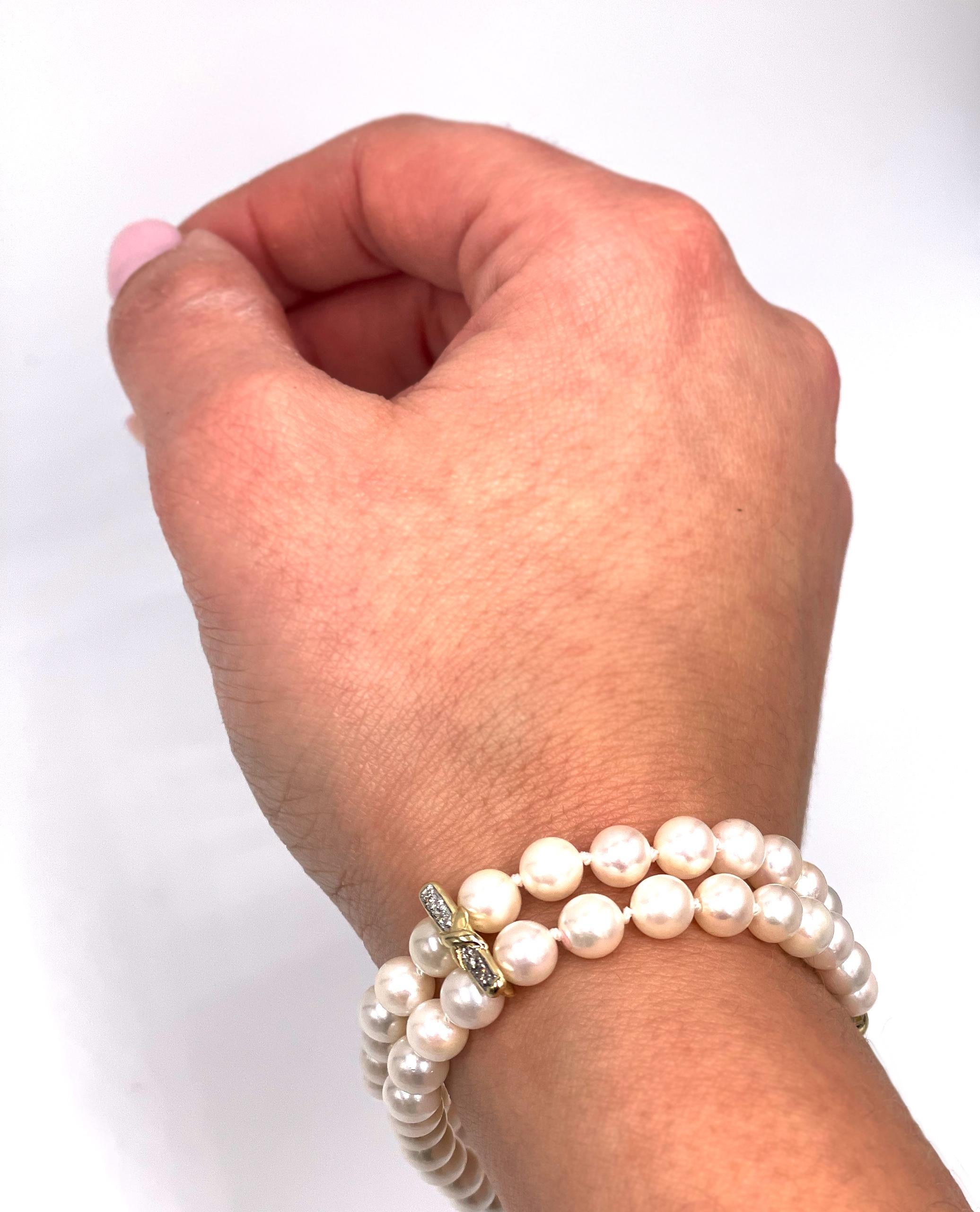 Round Cut Double Strand Cultured Pearl Bracelet with 14K Yellow Gold X Clasp with Diamonds For Sale