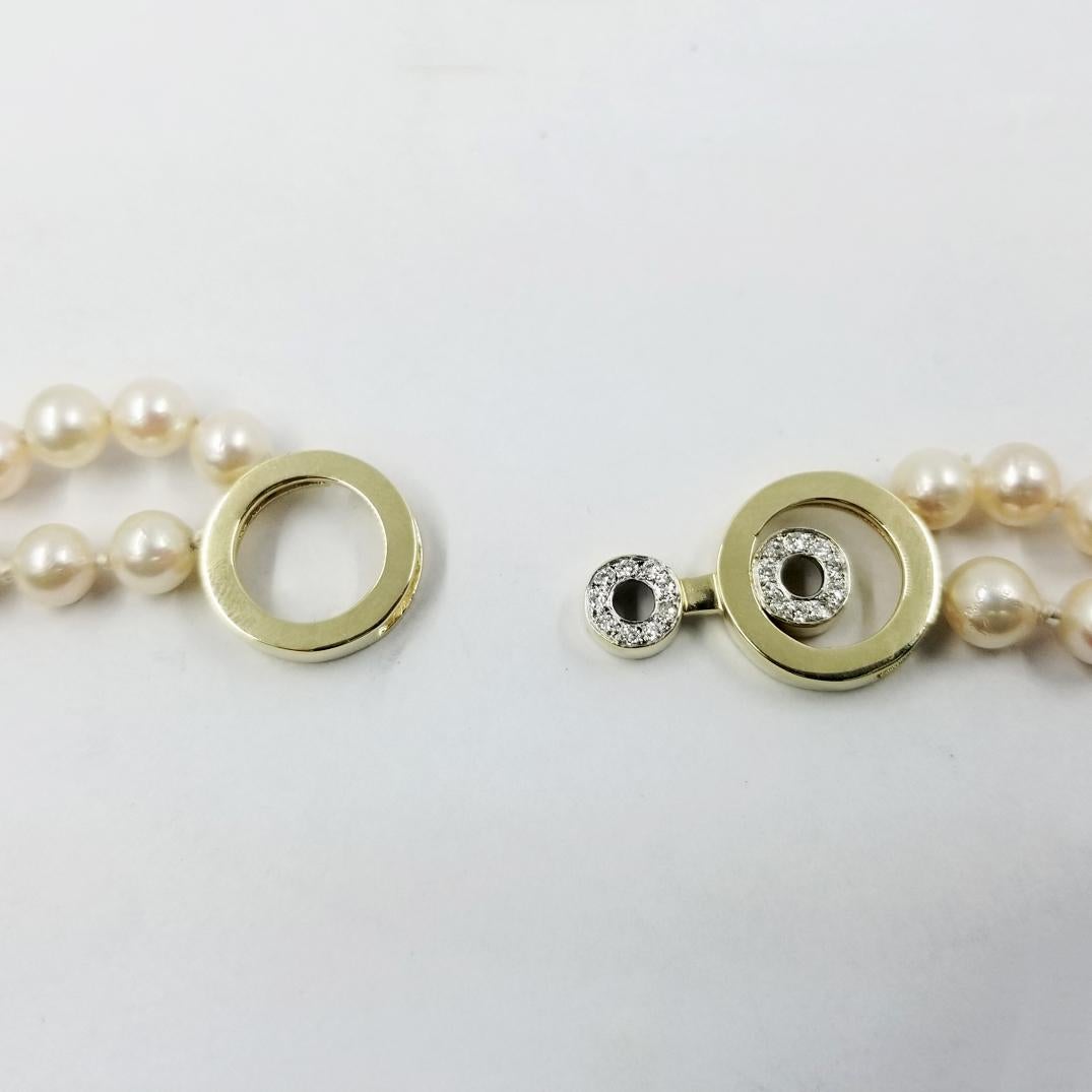 Round Cut Double Strand Cultured Pearl Necklace with Decorative Hidden Clasp