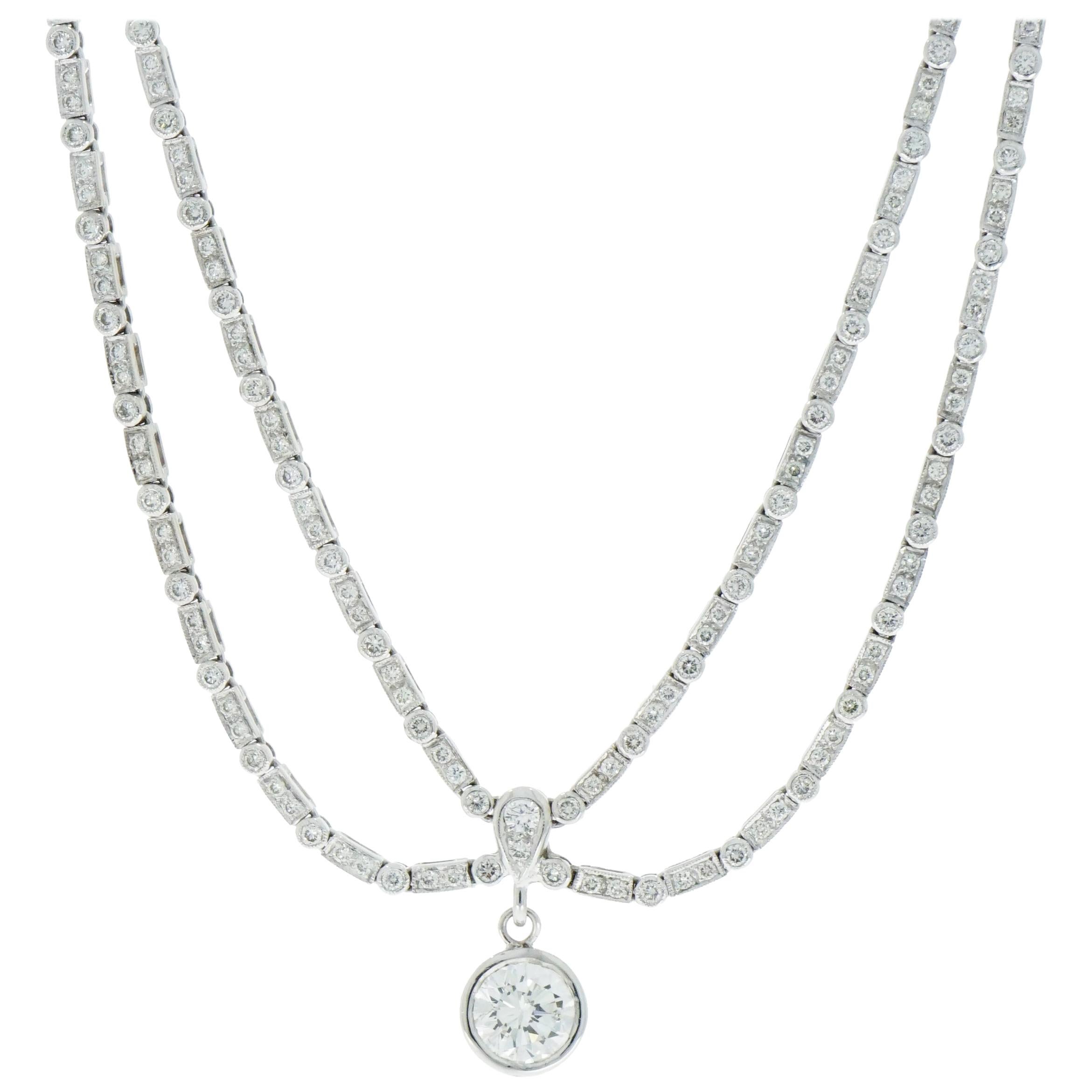 Double Strand Diamond Necklace with a Single Round Diamond Drop at