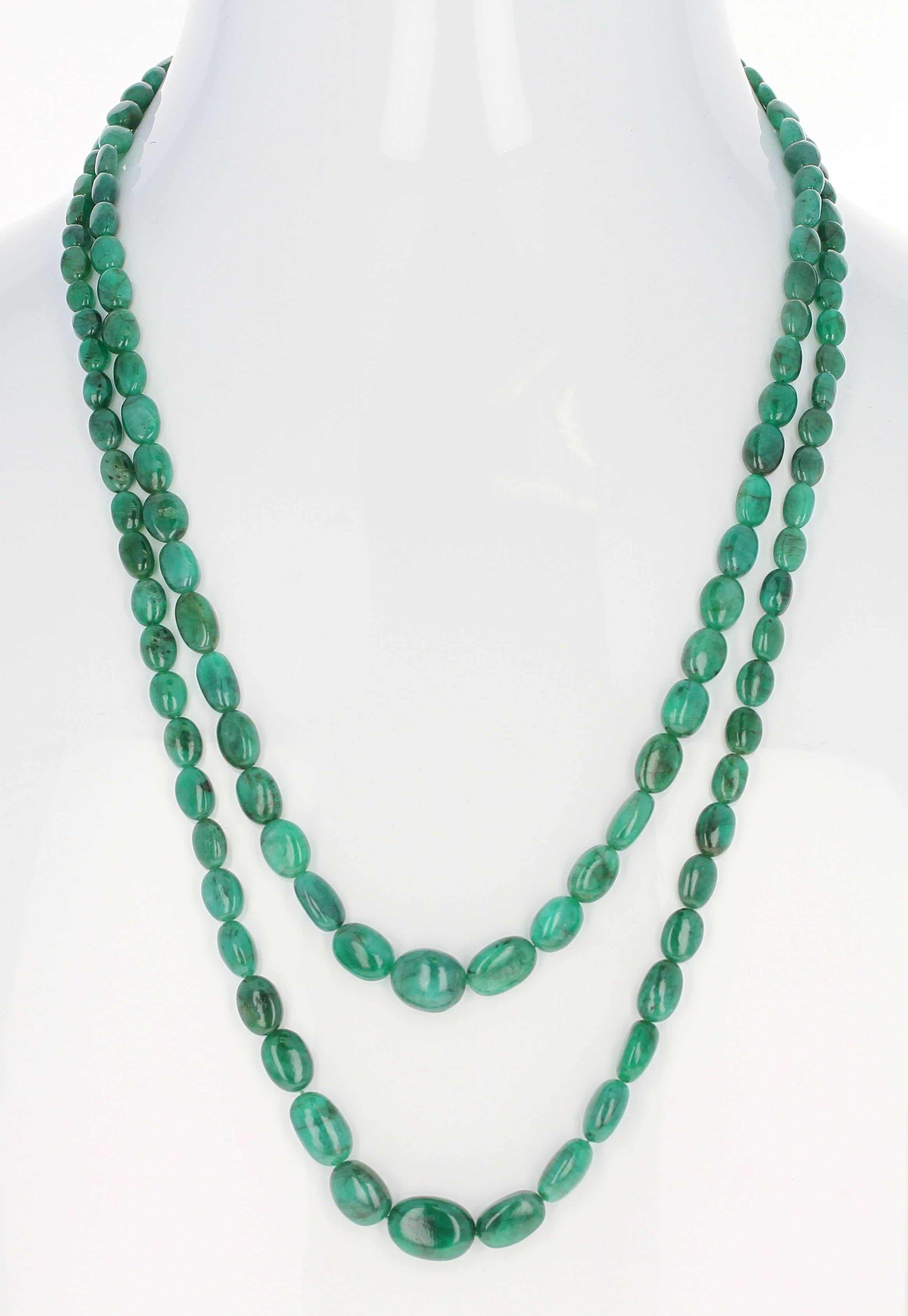 A necklace with Double Strands of Emerald Smooth Tumbled Beads with a Silver Toggle Clasp. Length: 17.5
