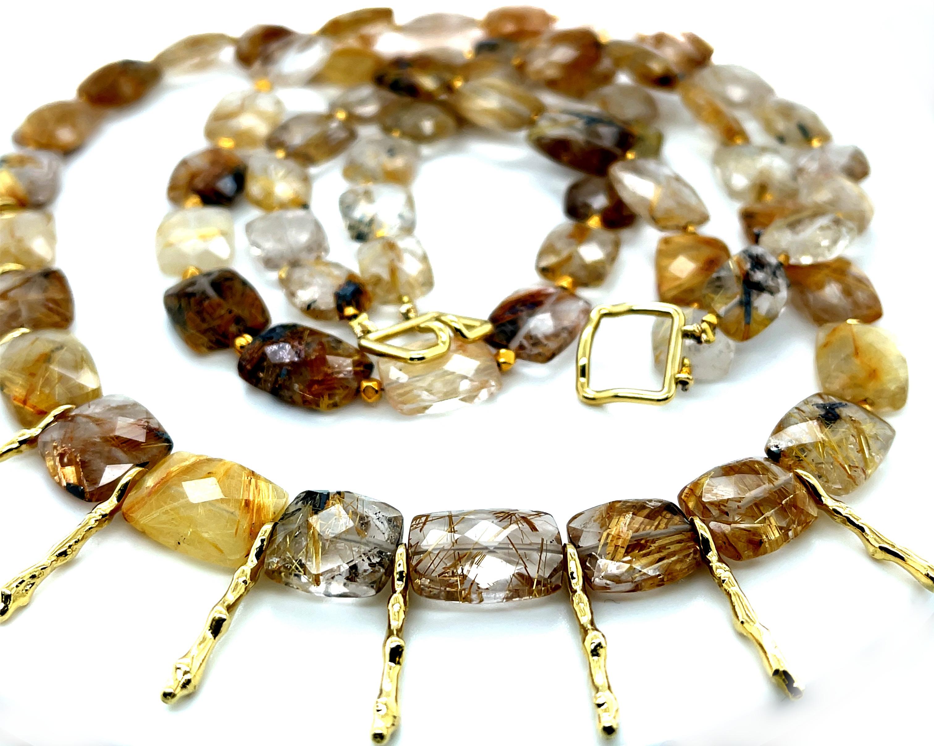 This dramatic rutilated quartz and gold necklace has a wonderfully organic, 