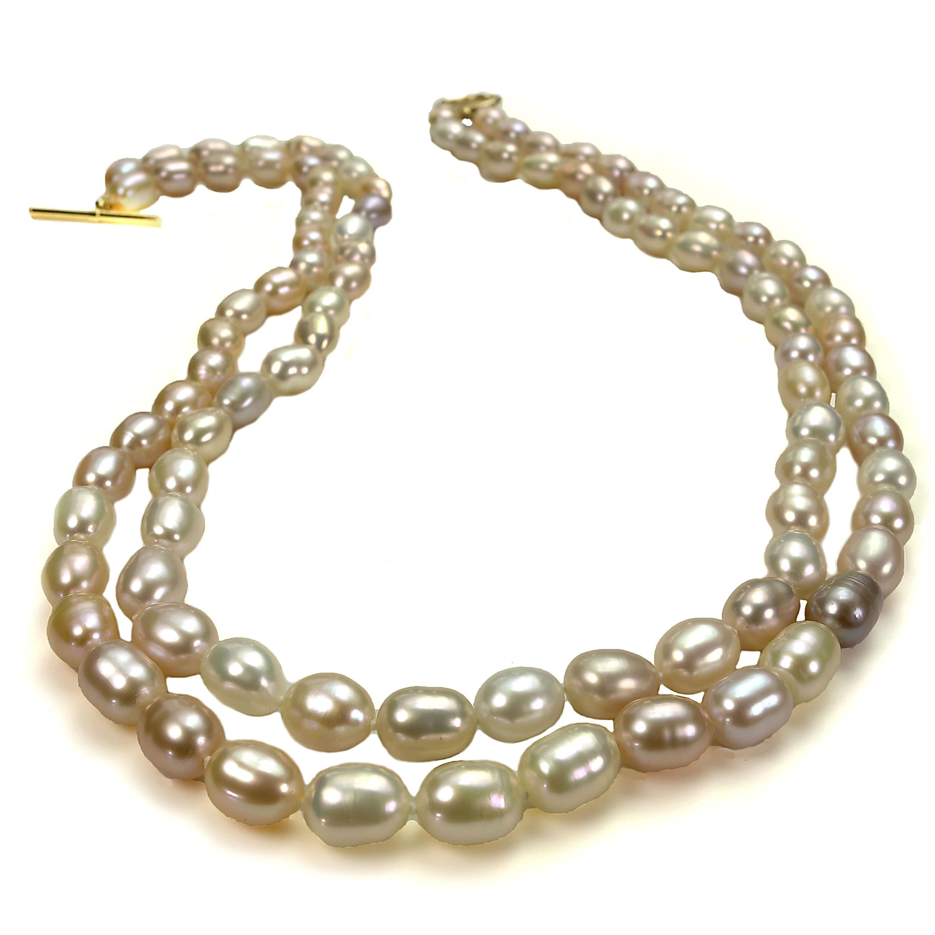 Delicate peach color Oval shape Freshwater Pearl Necklace. Peach is the predominant color, additionally there are creamy and mauve shades of pearls. This unique necklace is so classic you can wear it all the time and everywhere. It is one of those