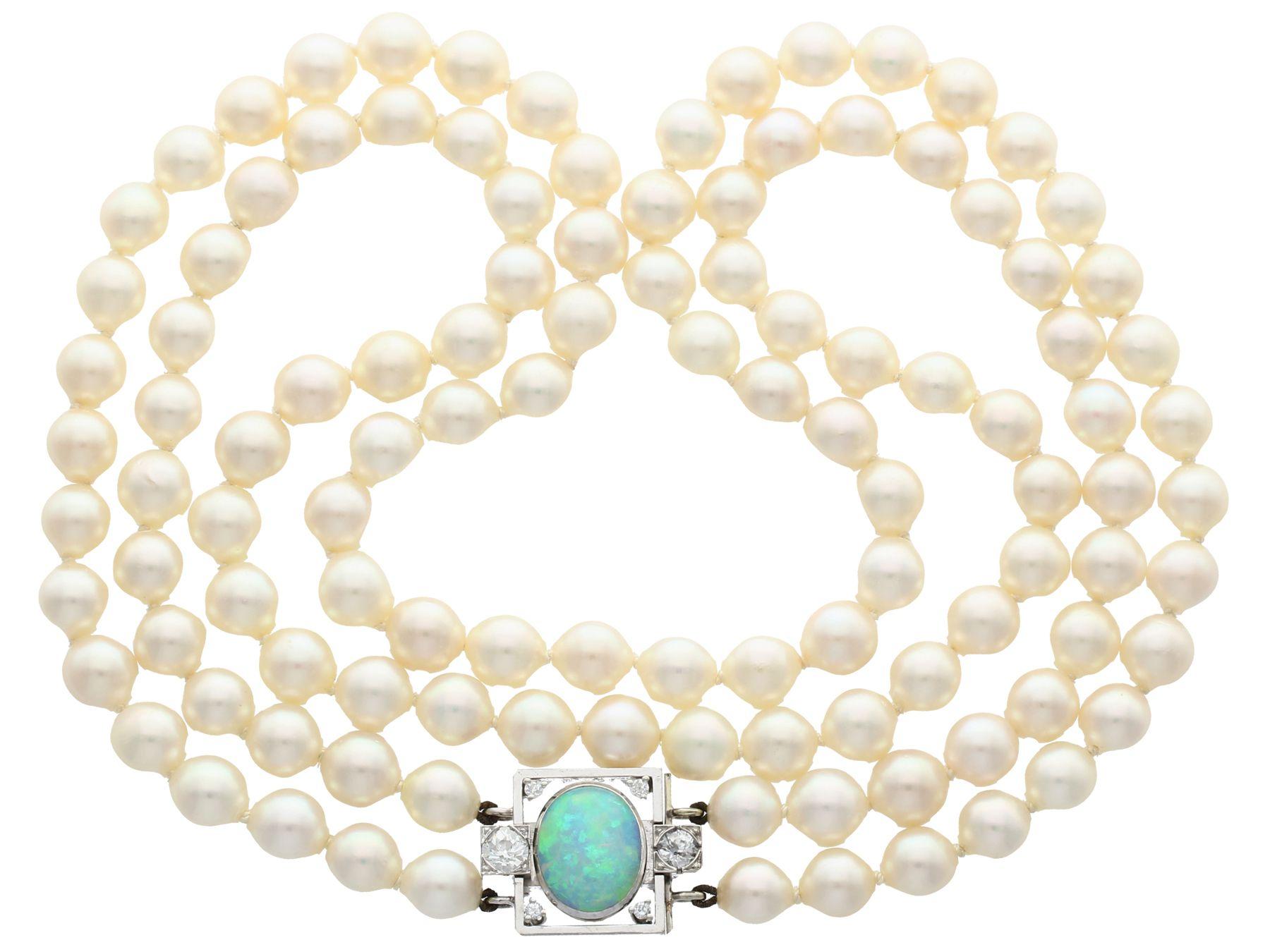 A fine and impressive vintage double strand cultured pearl necklace with an antique 2.01 carat opal and 0.78 carat diamond 18 ct white gold clasp; part of our diverse pearl jewelry collection.

This impressive vintage double strand pearl necklace