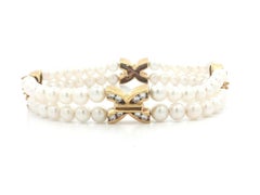 Zweisträngiges Perlenarmband mit 18-karätigen, vergoldeten Diamant-Verbindungsgliedern in X-Form