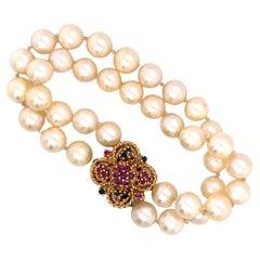 Vintage Double Strand Pearl Bracelet with Ruby and Sapphire Clasp in 14K Gold