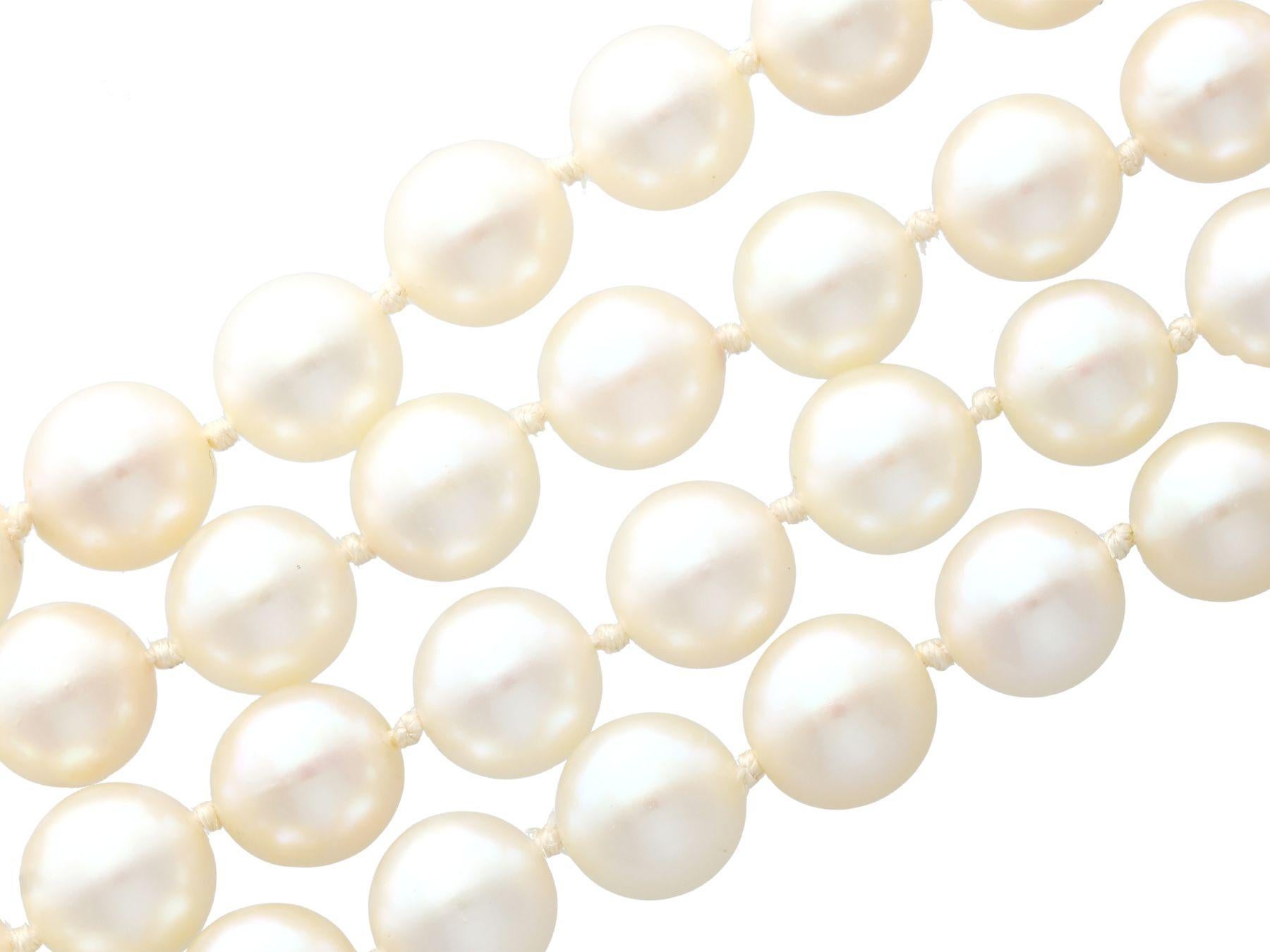 A fine and impressive double strand pearl necklace with a pearl. 0.30 carat diamond and 14 karat white gold clasp; part of our diverse pearl jewellery collections.

This fine and impressive vintage double strand pearl necklace has been crafted in