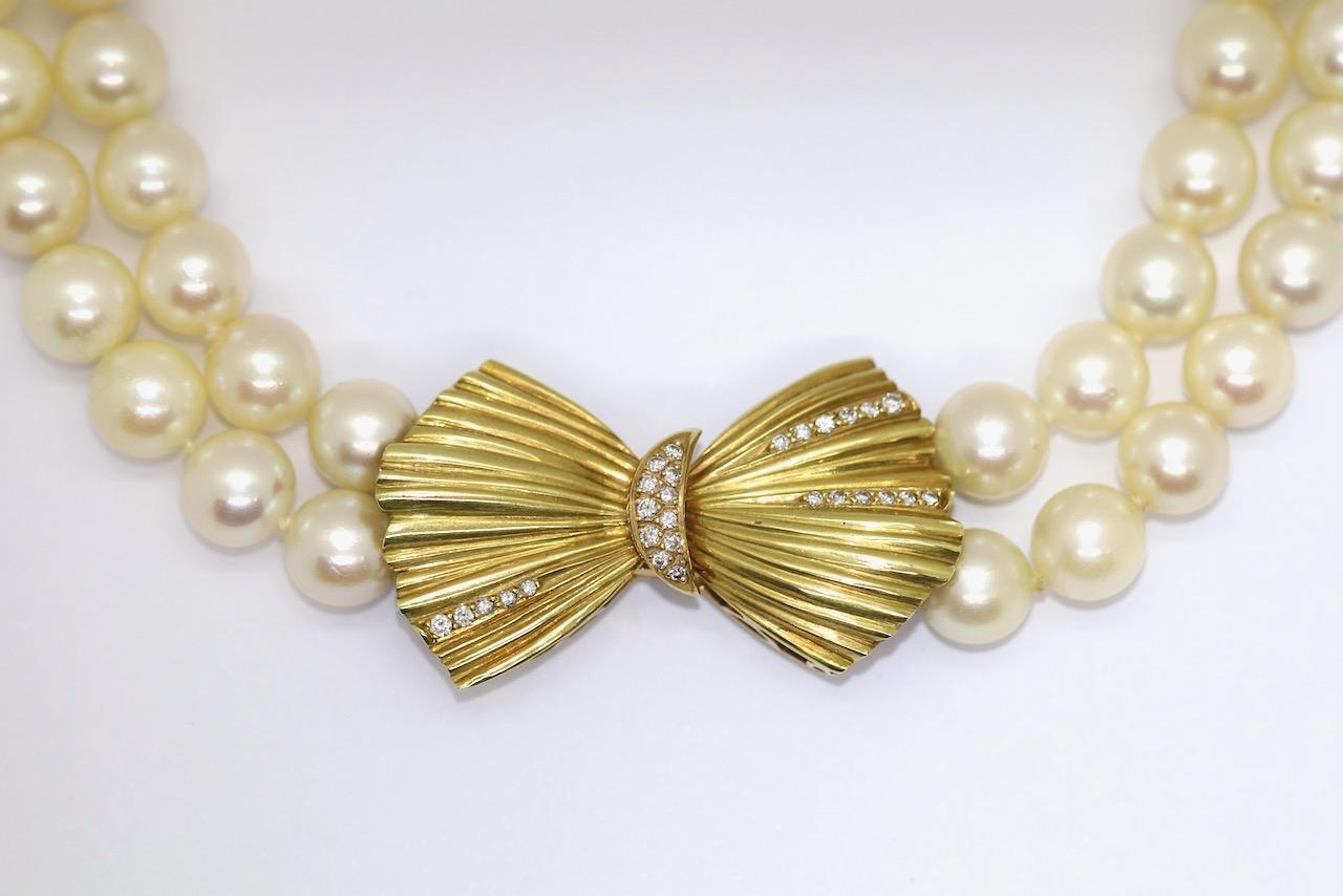 Charming double strand pearl necklace with 18k gold clasp and diamonds.

Clasp 38mm x 22mm.
Pearl average 7.5mm to 8mm.

Includes certificate of authenticity.