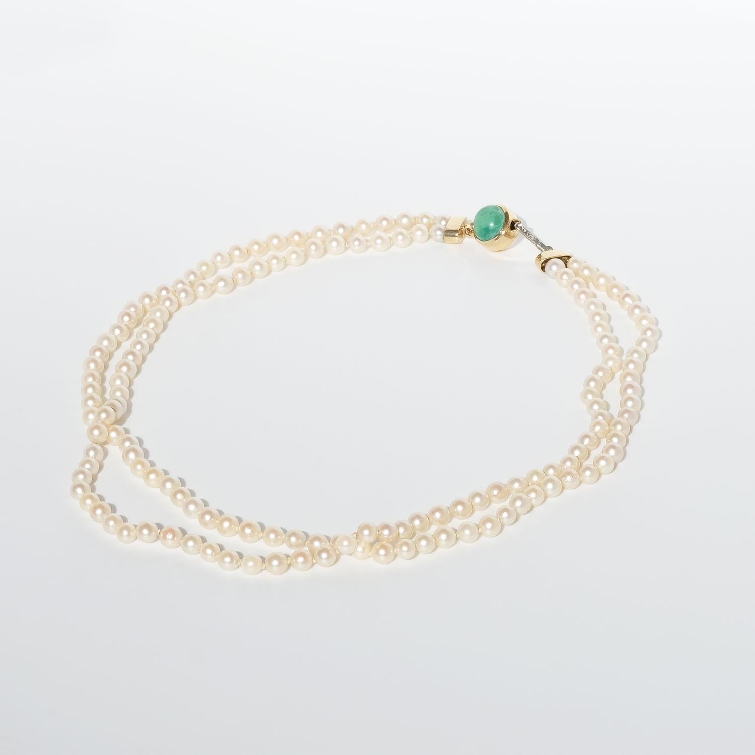 Ball Cut Double Strand Pearl Necklace with a 18k Gold Lock For Sale