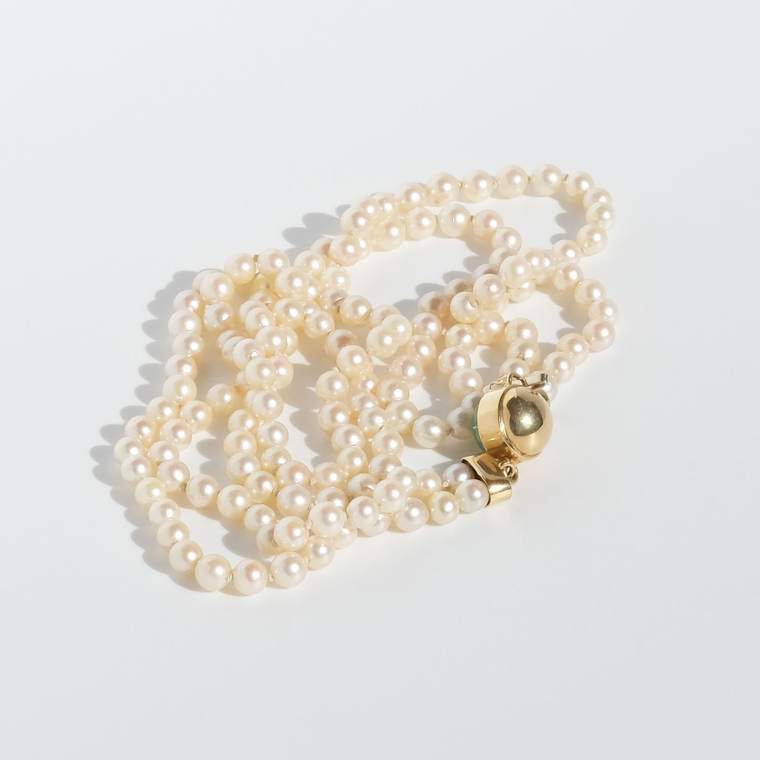 Double Strand Pearl Necklace with a 18k Gold Lock For Sale 4