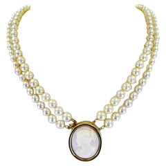 Double strand pearl necklace with cameo clasp