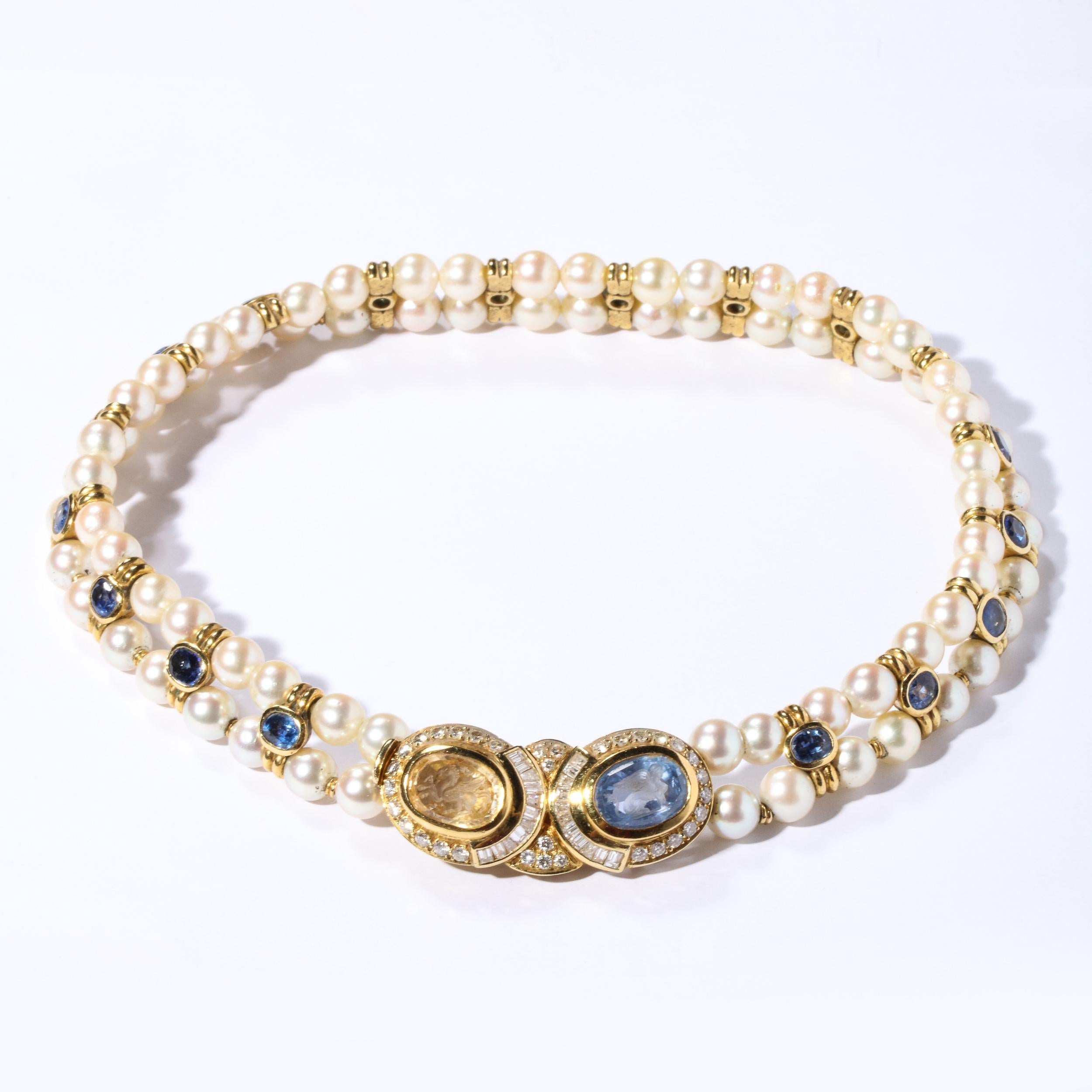 These stunning Double strand pearls are comprised of 76 fine quality pearls approximately 7 mm each with 18 spacers of 18k gold set with oval shaped iolite stones bezel satin 18k. The center clasp is set with a oval citrine and iolite both carved