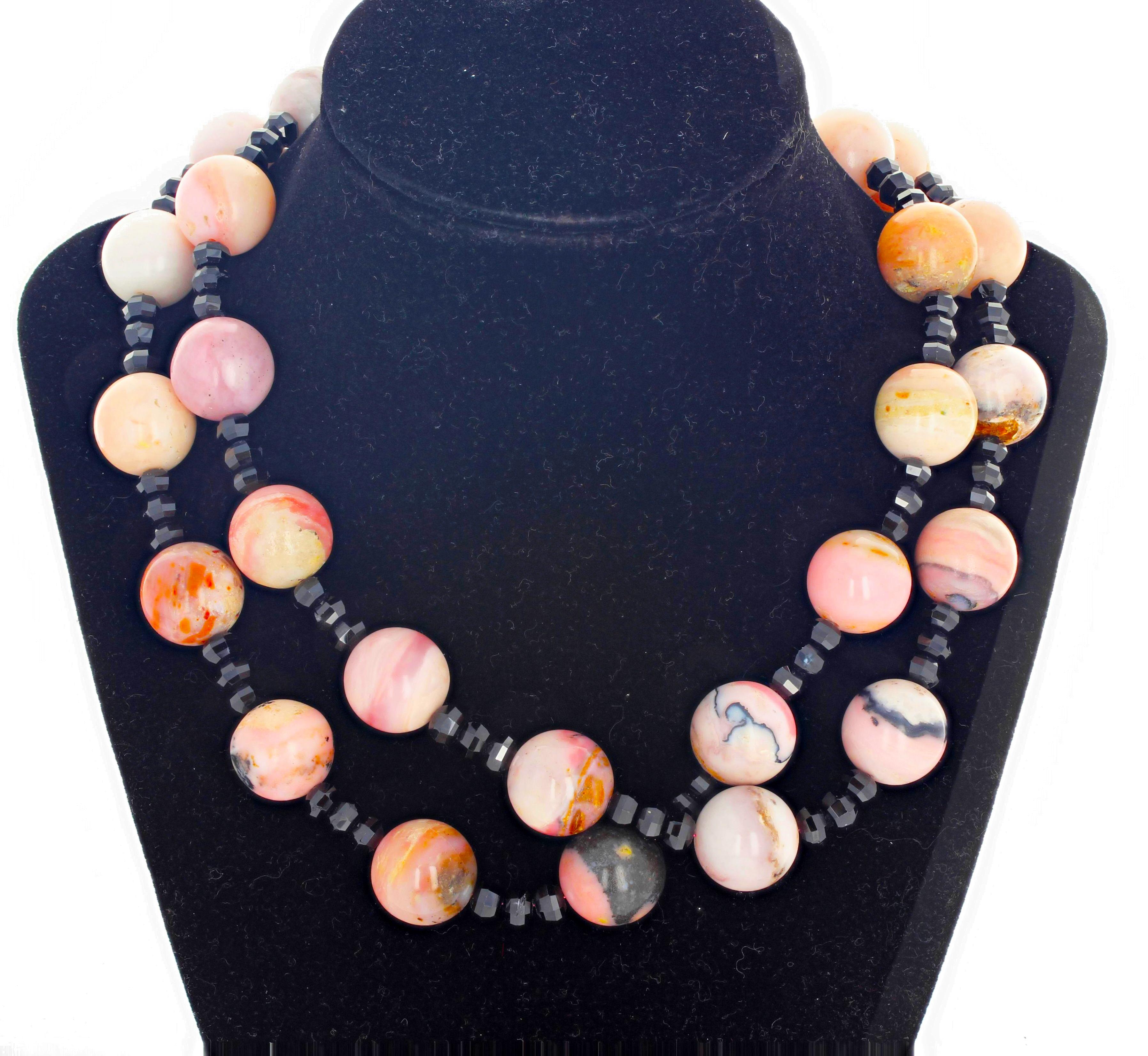 This double strand of RARE and stunning highly polished natural Peruvian Opals (16 mm) enhanced by the glistening gem cut black Spinel rondels set in a 17.5 inch long necklace with silver plated easy to use hook clasp.  