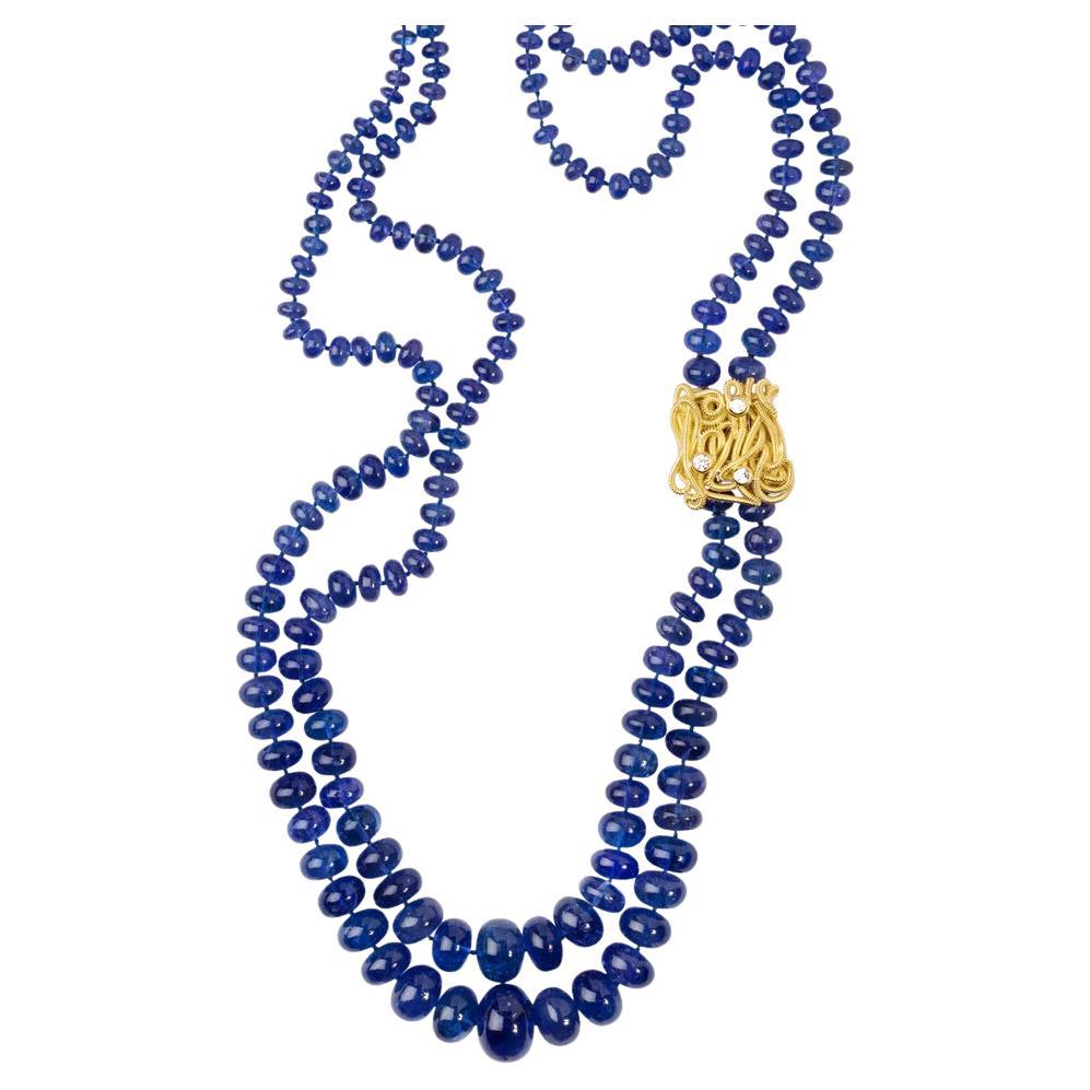 Doppelreihige Tansanit-Halskette mit 18 Karat geflochtenem Goldverschluss und Diamanten