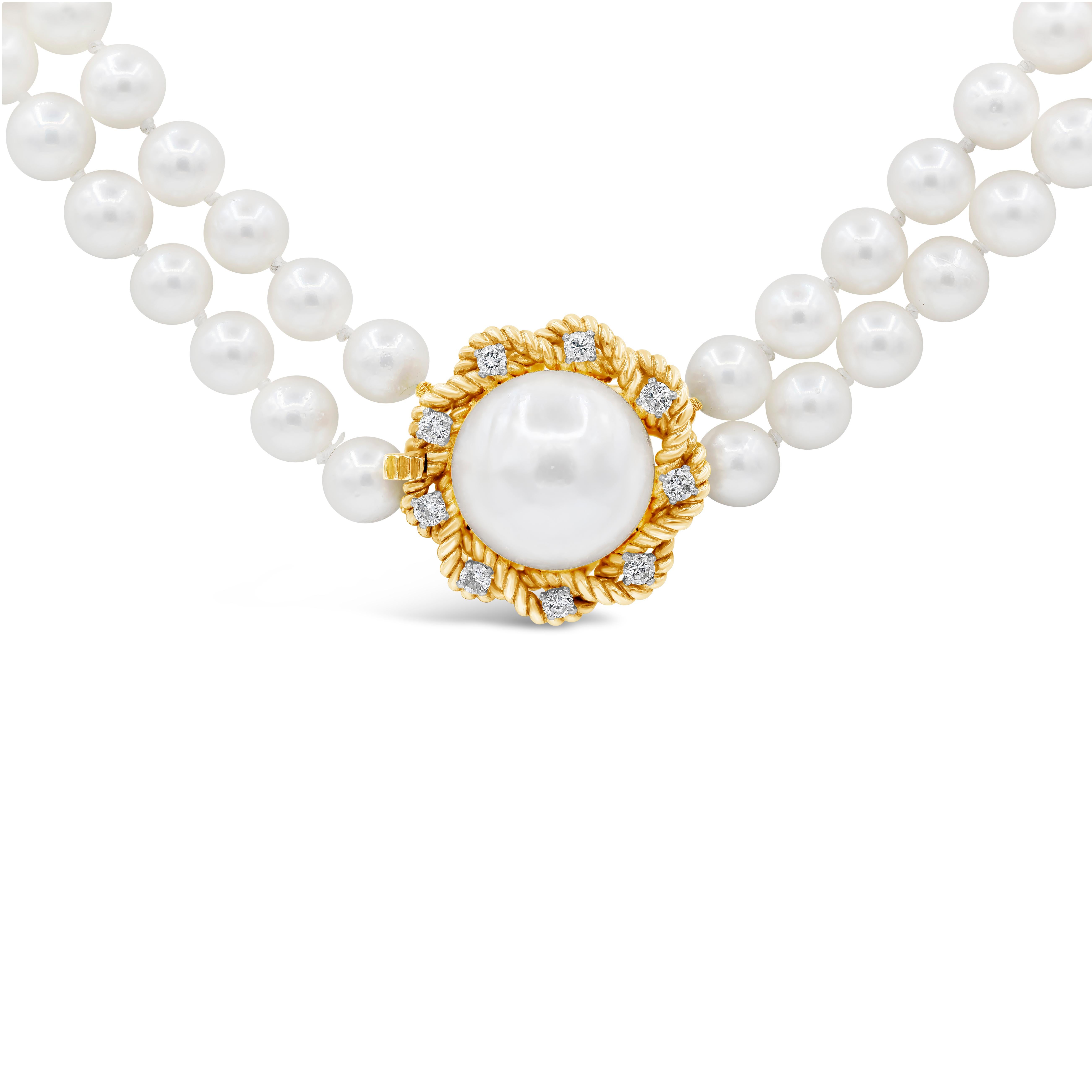 A chic pearl and diamond necklace showcasing one large pearl set in a weaving rope setting accented with 0.40 carat total brilliant round diamonds. Attached to two beautiful strands of pearls and Made in 18K yellow gold.