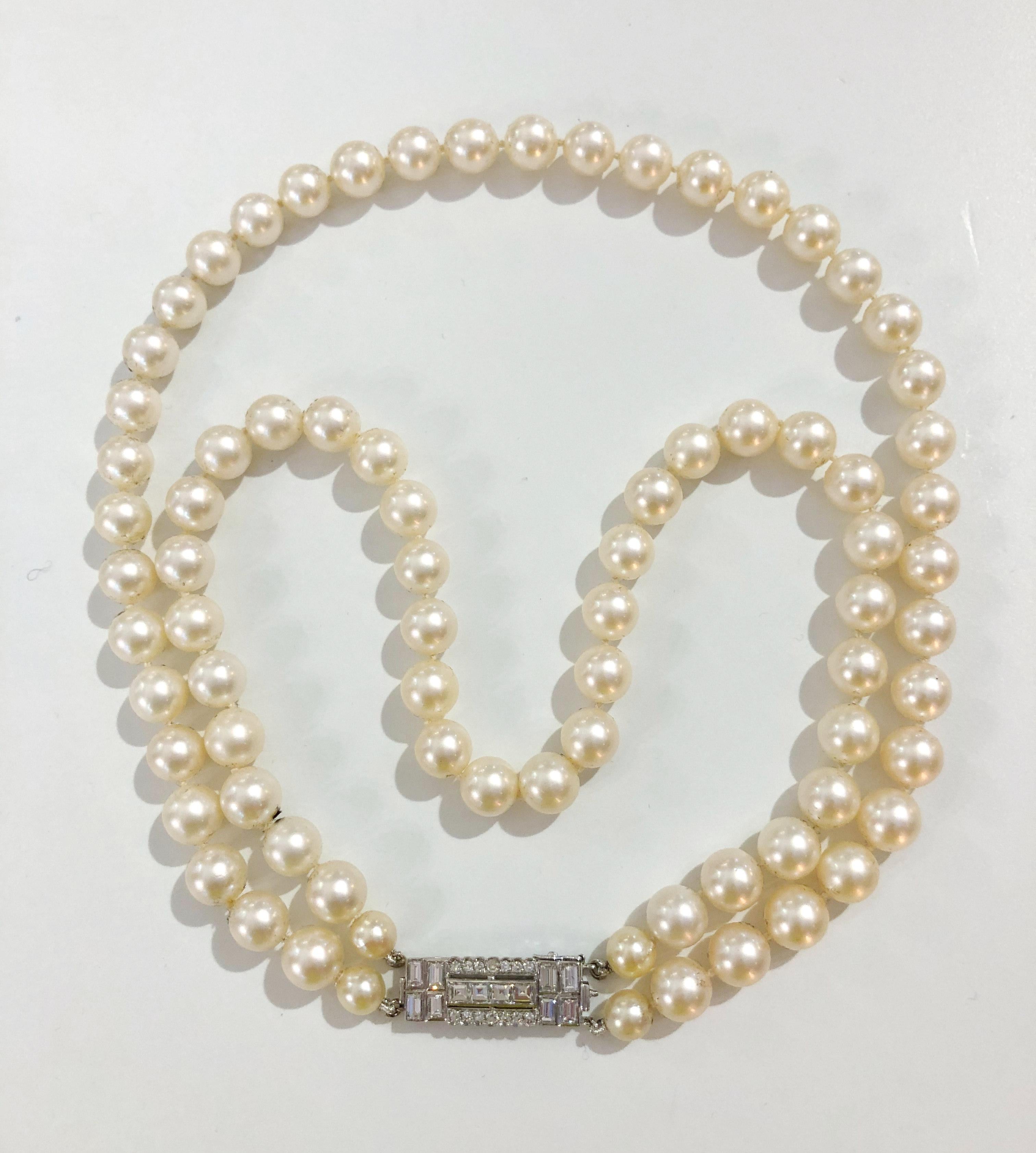 Vintage necklace with double strands of 9mm pearls, and the clasp is in brilliant diamonds total of 2.5 karats, Italy 1970s-1980s
Length 45 cm
