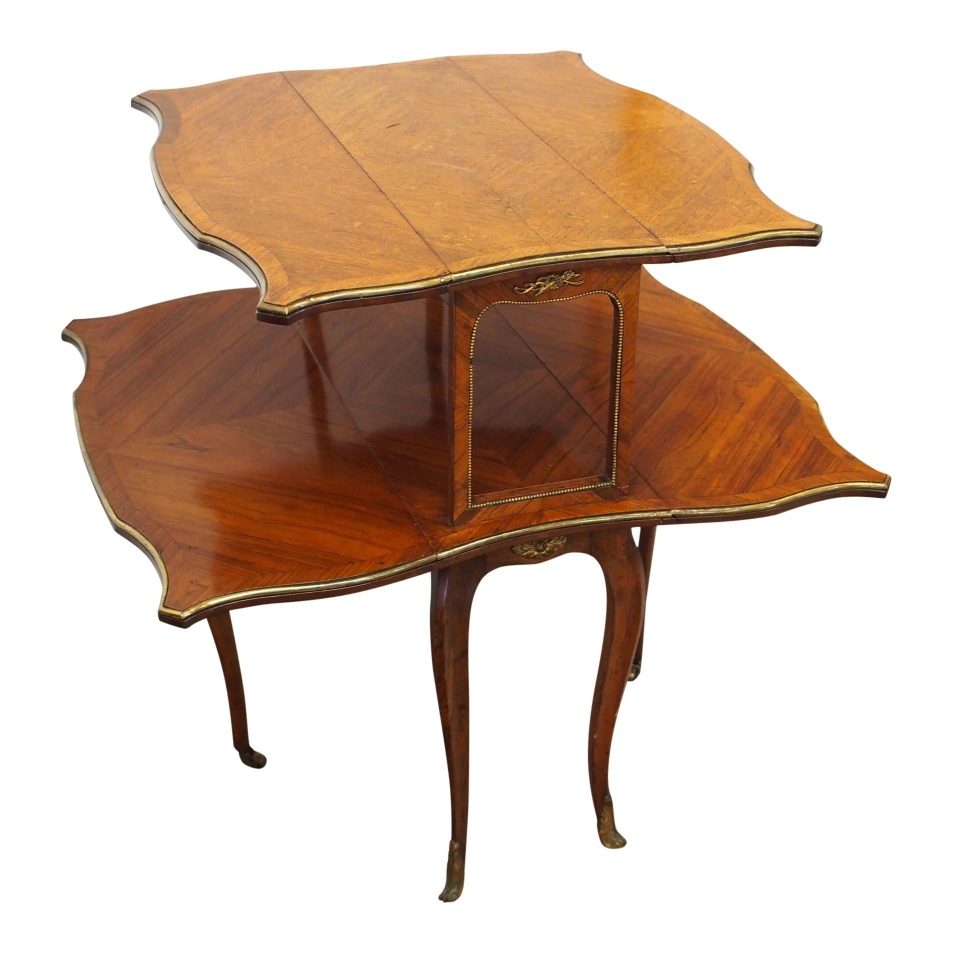 Exhibition quality, rare double Sutherland table or étagère by the famous cabinetmakers, Morison of Edinburgh, circa 1800. The serpentine shaped table flaps have profuse marquetry inlaid and figured walnut on the top layer and a rosewood lower