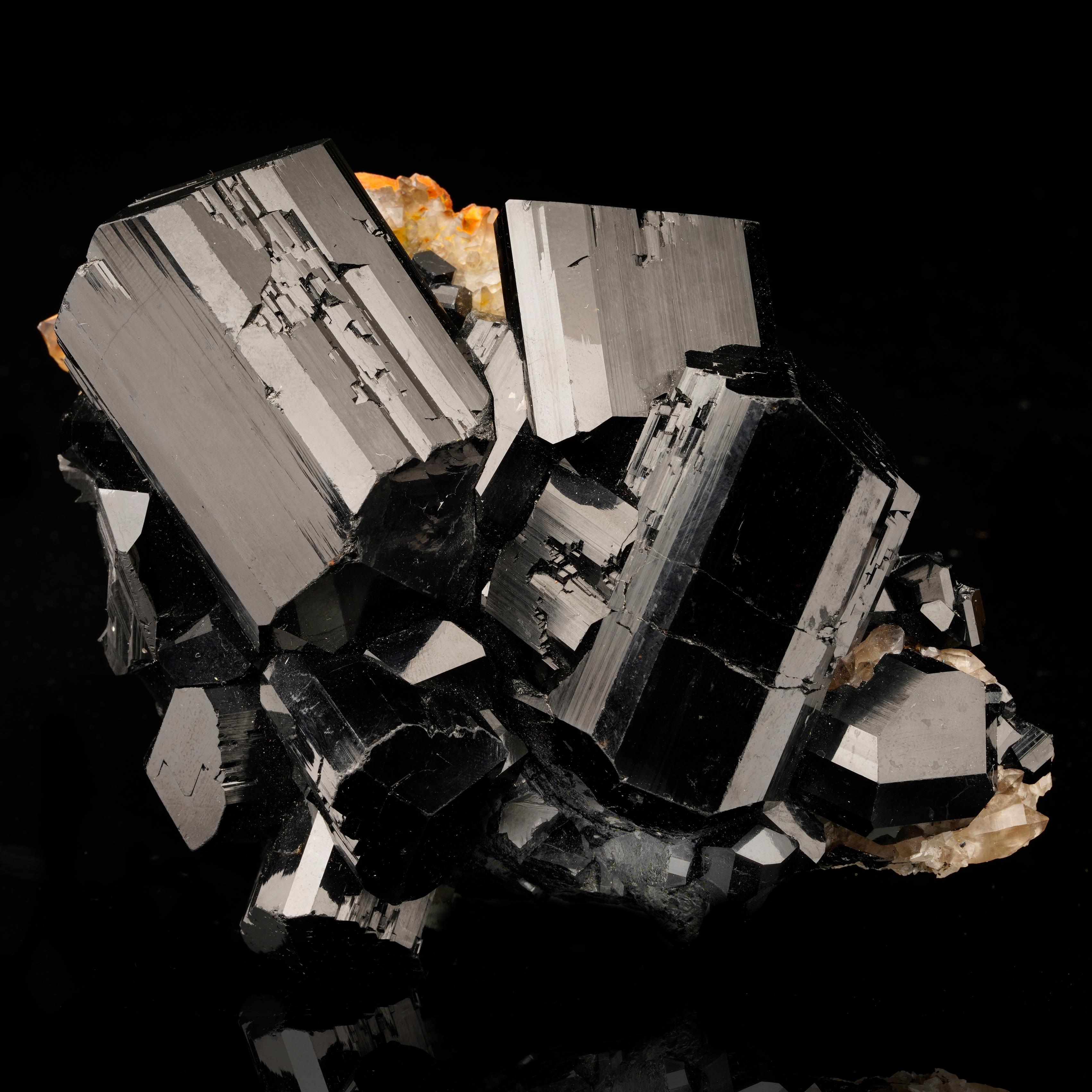This sizable, inky schorl specimen from Namibia is a unique acquisition for its incredible luster and the fact that the double terminated crystals grow in a cluster. Any visible 