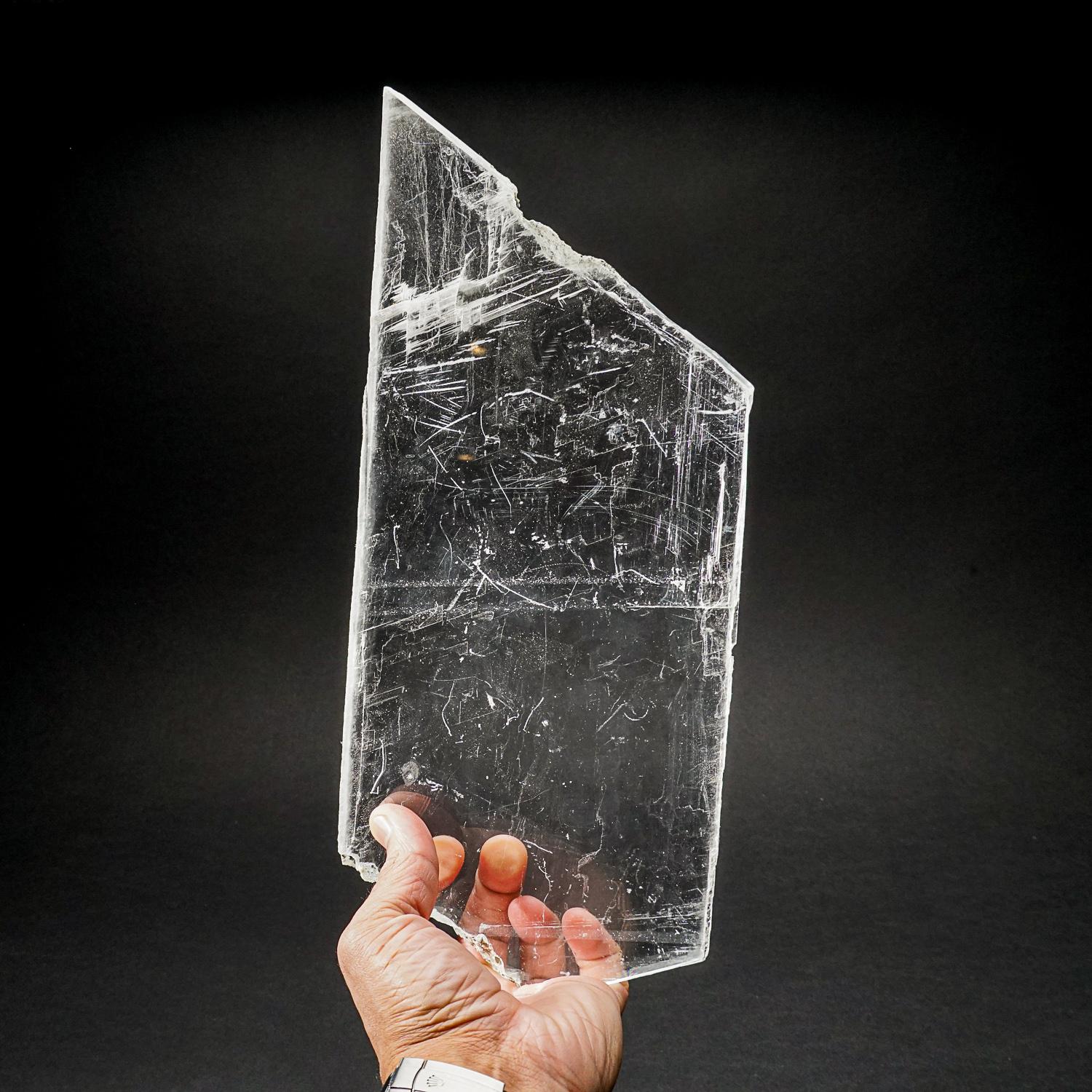 Large optical, water-clear crystal of selenite with clean, lustrous surfaces. The crystal is doubly terminated, with sugary white micro crystals coating one termination. It has an impressive structure and symmetry fashioned by the Earth, making it