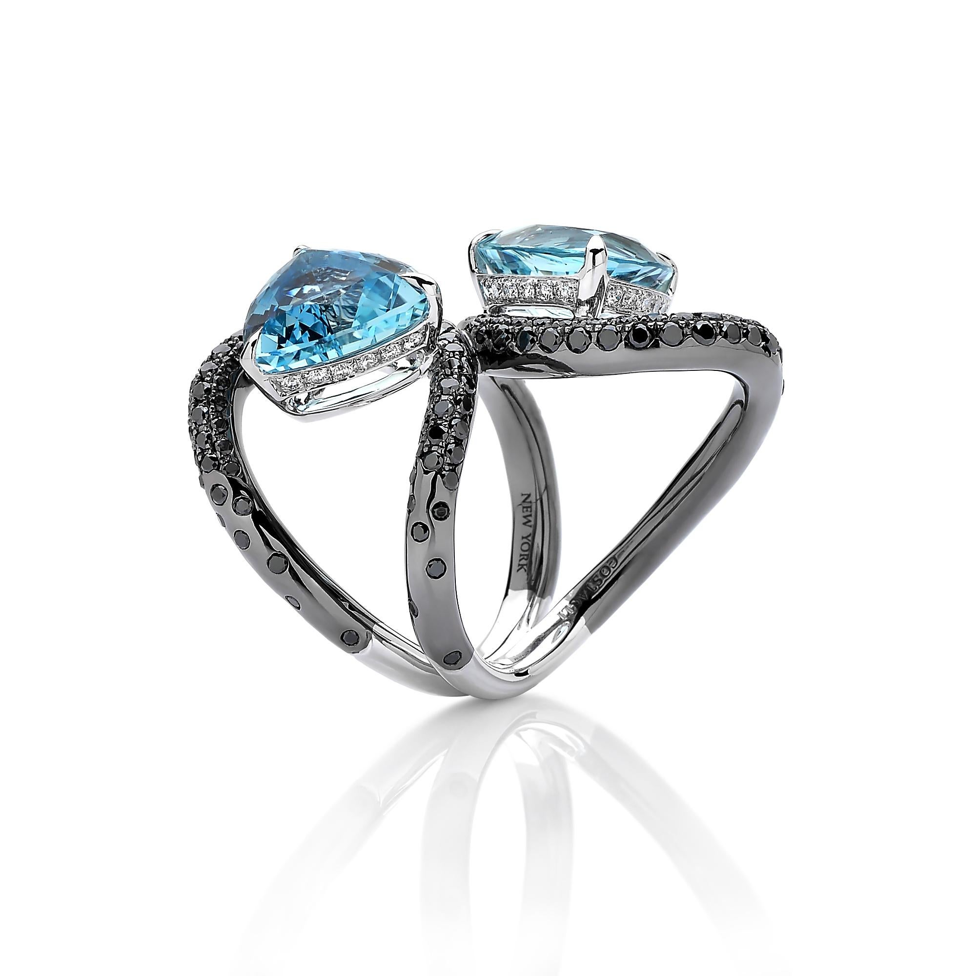From the 'Intrecci' Collection, one-of-a-kind double trillion cut aquamarine ring set in 18 karat white gold with black rhodium finish and pave-set black diamond detailing. 

The beauty is in the details - from the combination of hues, the color of