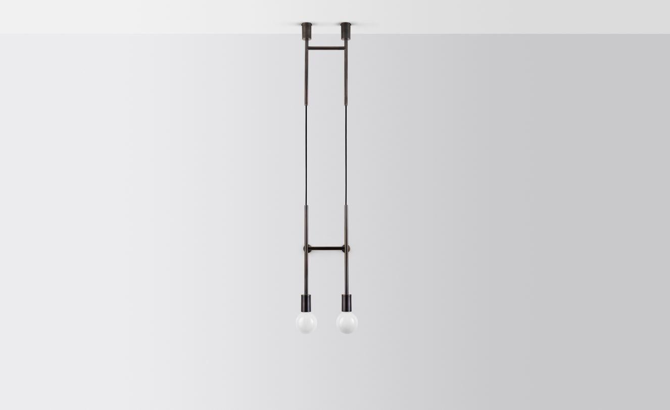 Double wall step by Volker Haug
Dimensions: D 24.8 x W 29.5 x H min 108 cm
Materials: Polished, bronzed brass or steel
Cord: Fabric or metal
Finish: Raw, satin lacquer or powdercoat
Weight: approximately 2.4 kg

Lamp: 240V E27 (120V E26 US)