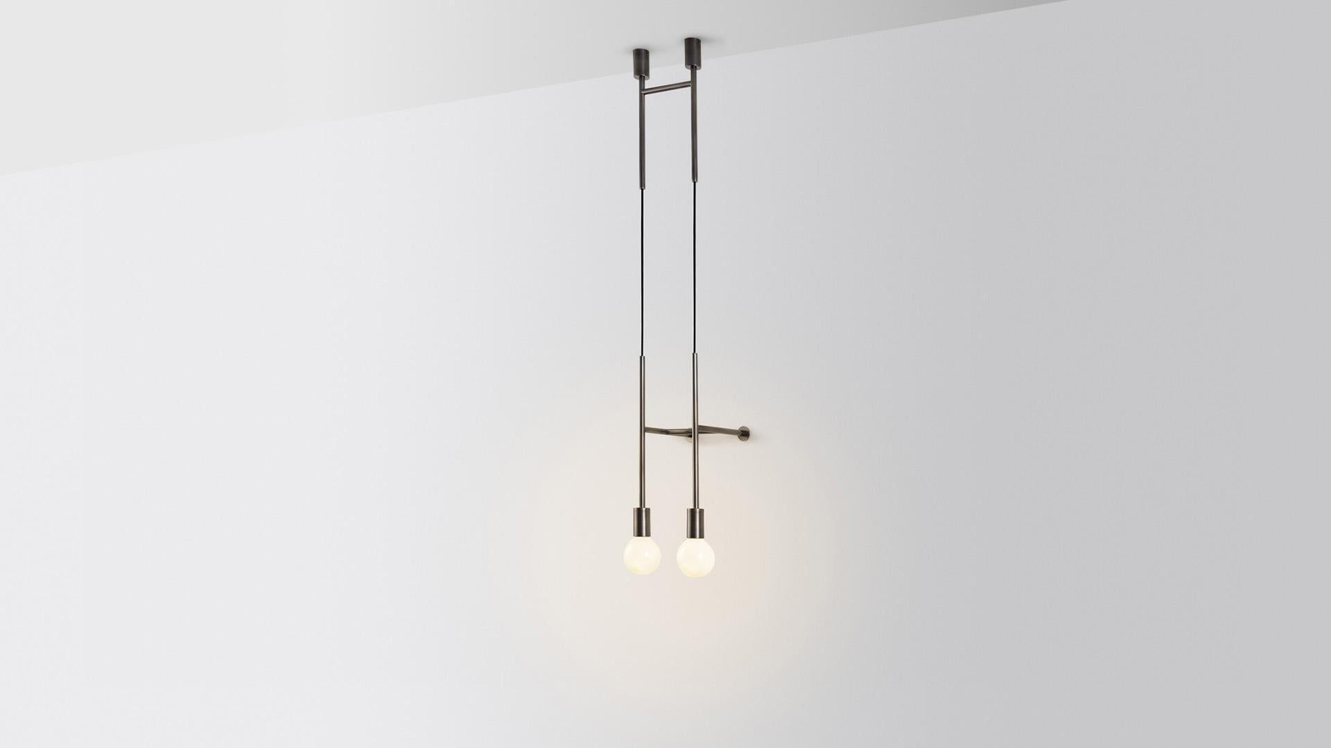 Double wall step light by Volker Haug.
Dimensions: D 24.8 x W 29.5 x H 108 cm. 
Material: Brass. 
Finish: Polished, Aged, Brushed, Bronzed, Blackened, or Plated
Cord: Fabric or metal
Lamp: Opal G95 LED (E26/E27 110 - 240V, 12V version